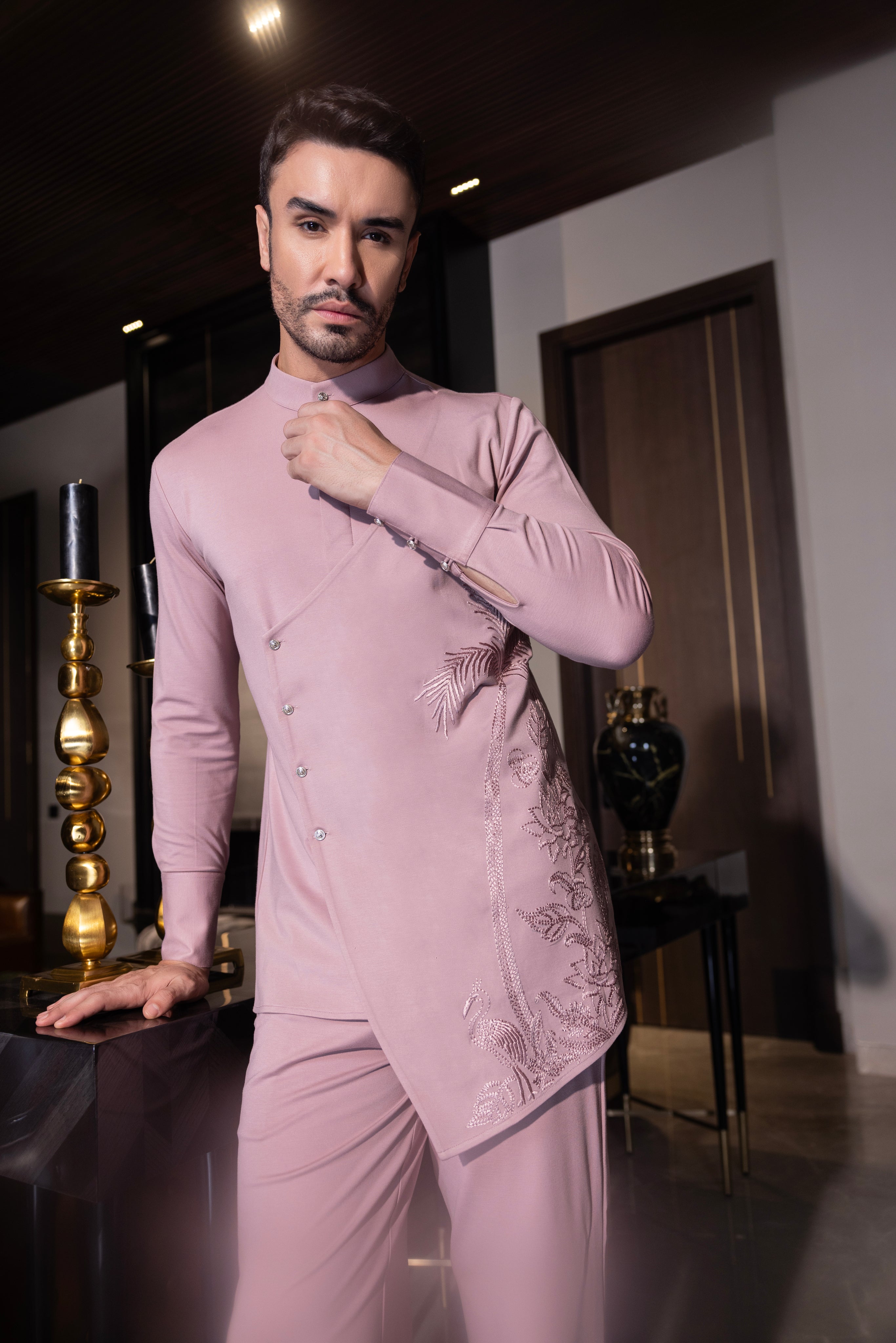 Pink hand-embroidered kurta with draping details paired with a matching aligadhi set.