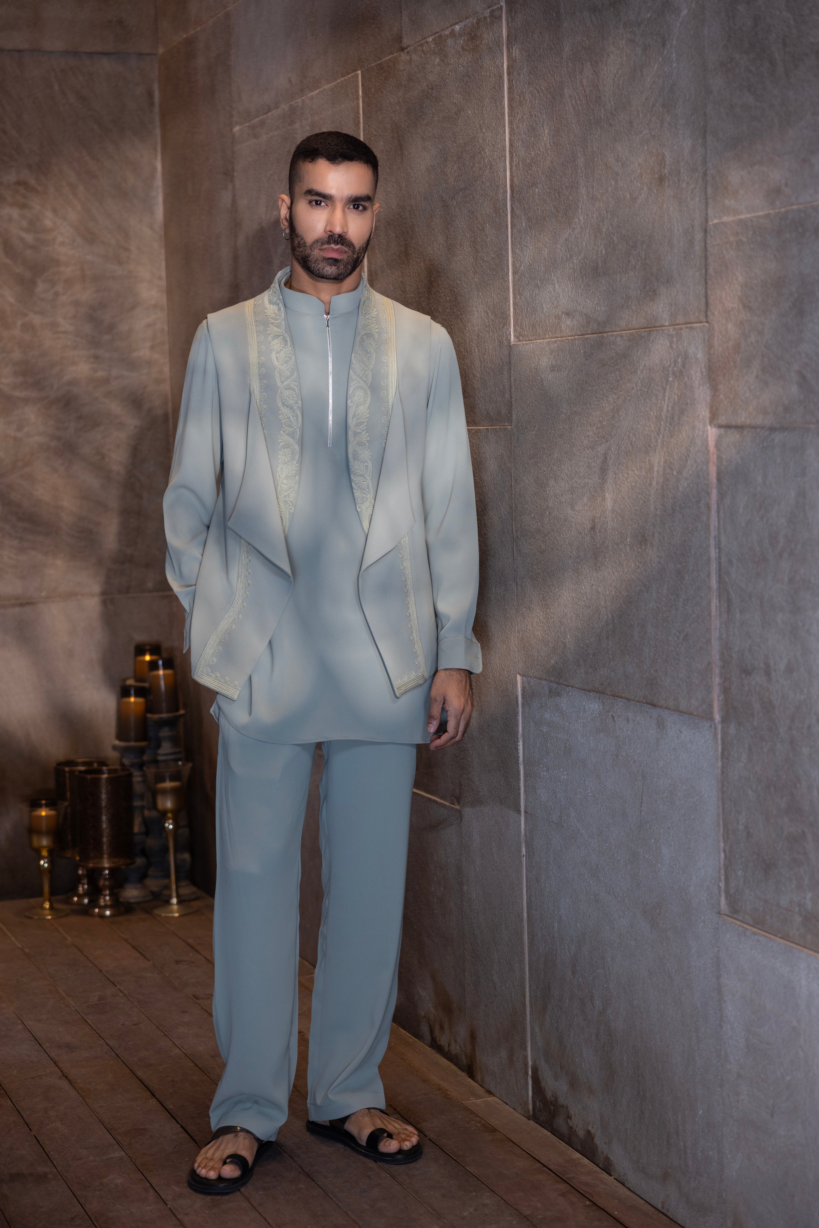 Pista Green draped waistcoat with  montone hand-embroidery paired with a matching kurta and aligadhi set.
