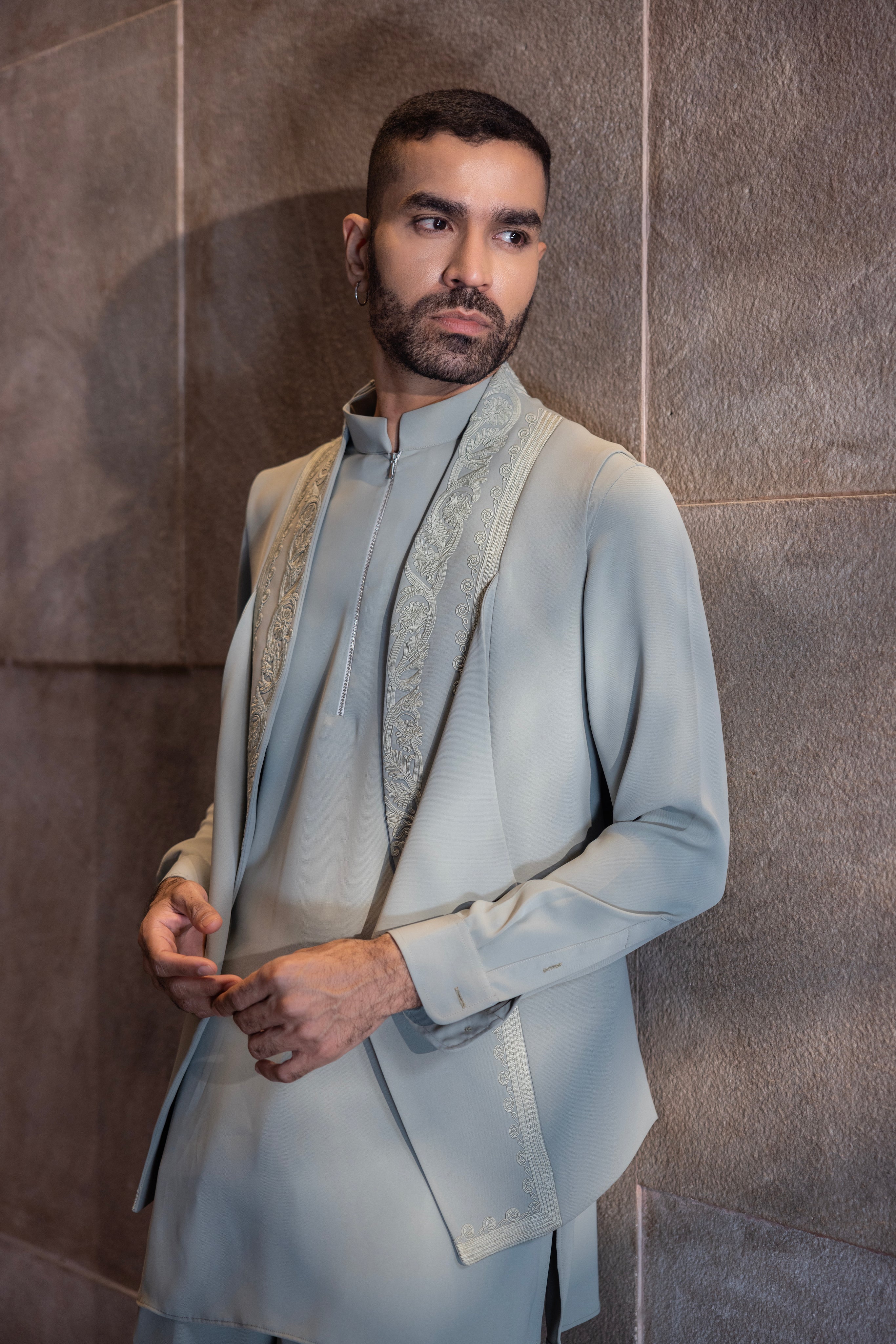 Pista Green draped waistcoat with  montone hand-embroidery paired with a matching kurta and aligadhi set.
