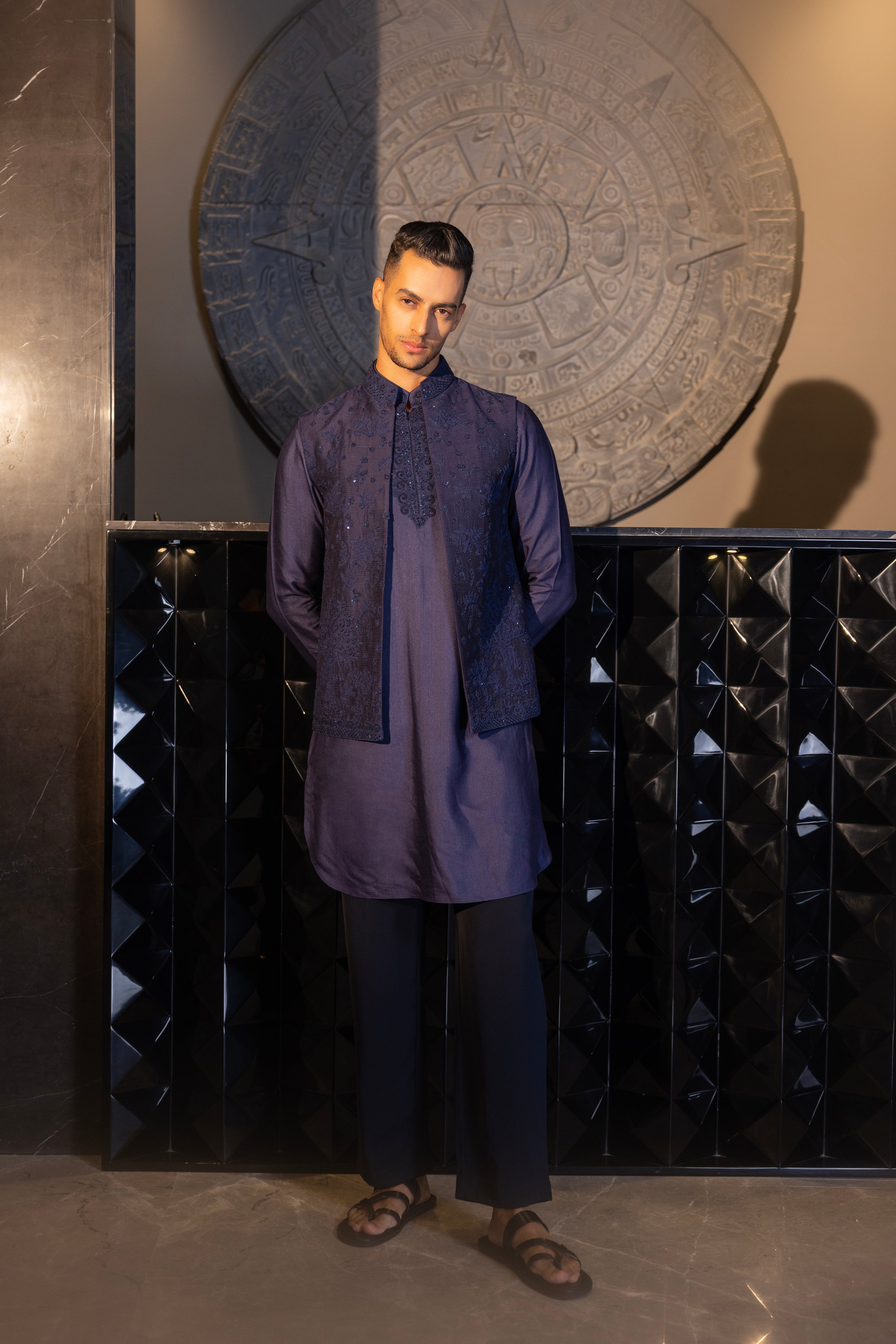 Banarasi Silk Navy Blue hand-embroidered waistcoat paired with an embroidered kurta and an aligadhi.