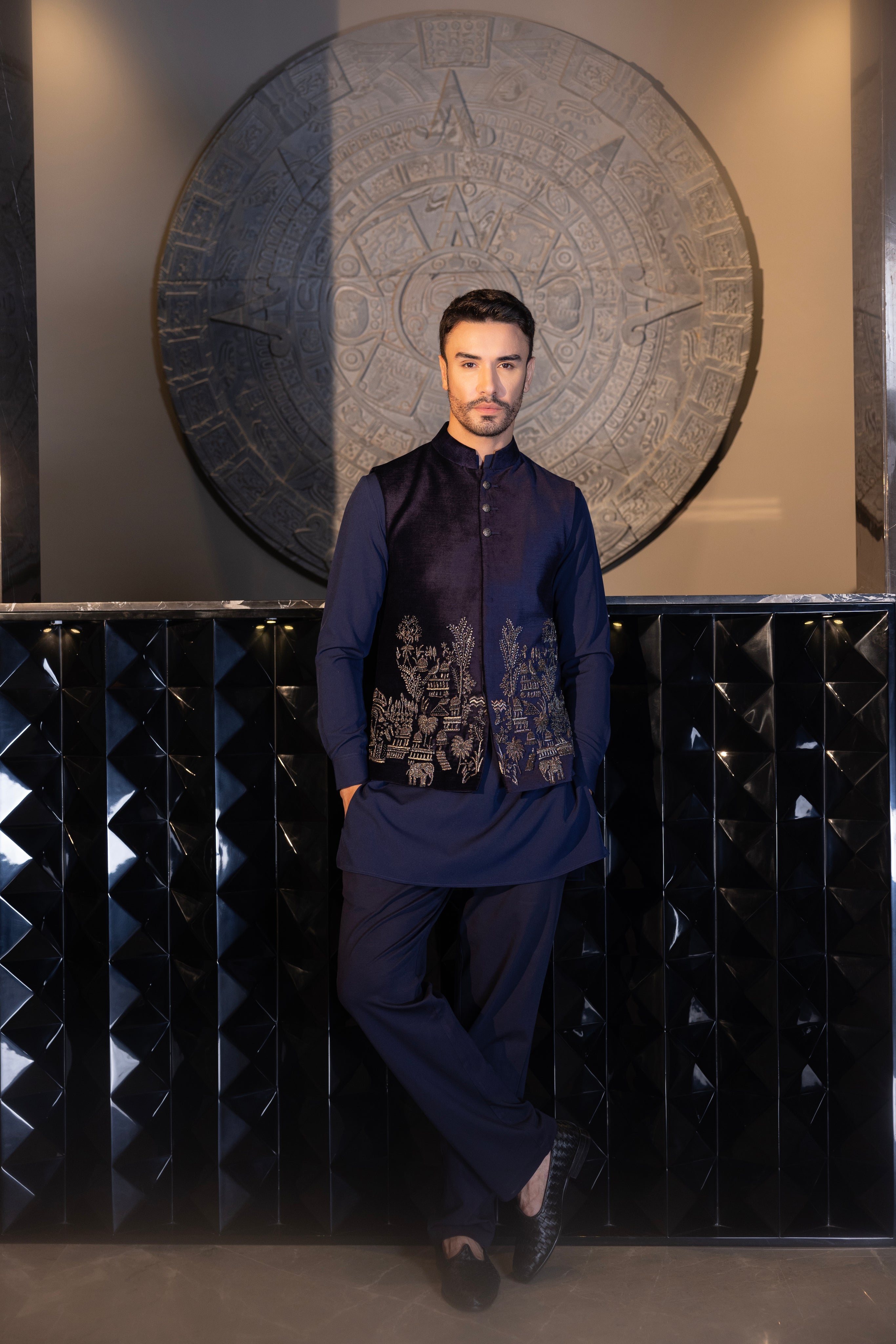 Navy Blue hand-embroidered waistcoat paired with a matching kurta & aligadhi set.