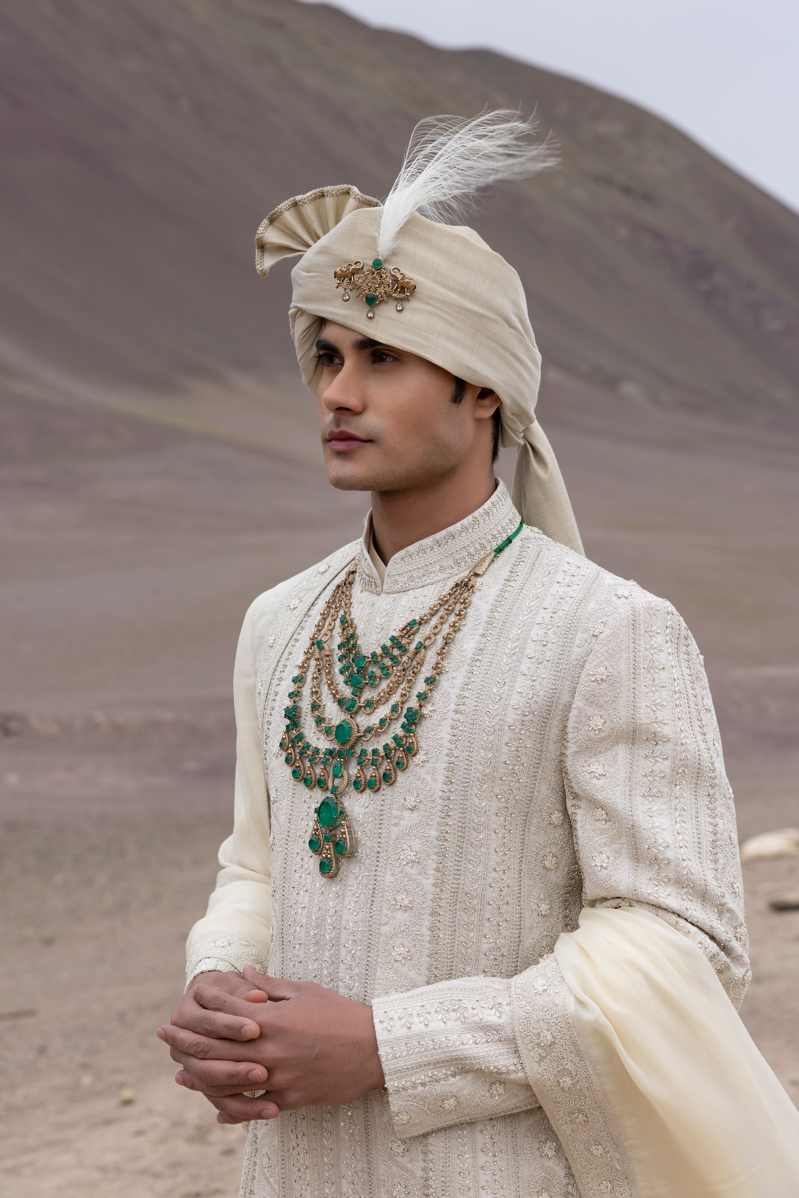 Light Gold raw silk sherwani with intricate hand-embroidery paired with a modal kurta pyjama & an organza stole.