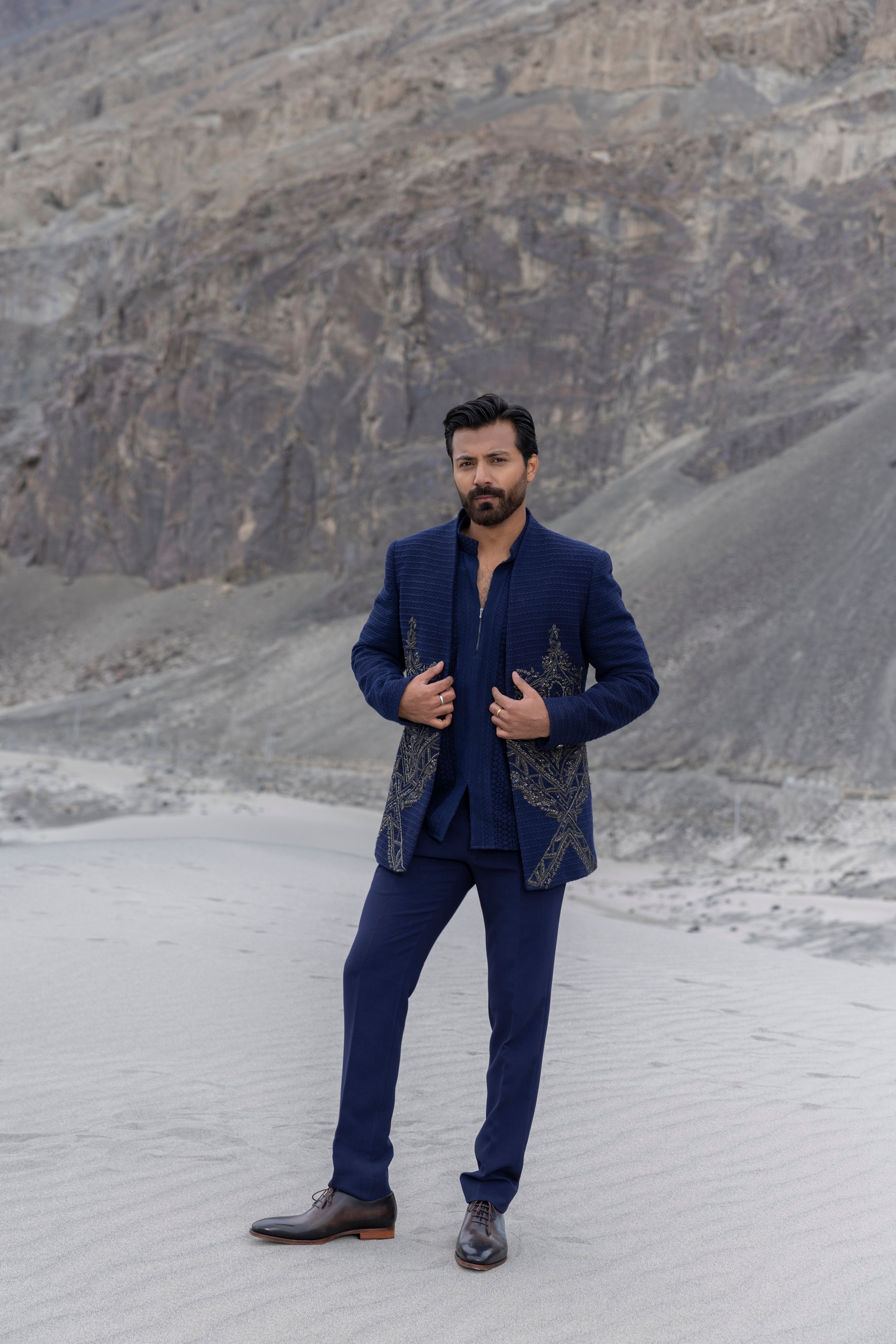 Navay Blue crochet front open indowestern jacket with contrast hand-embroidery  paired with matching crochet short kurta and a pant.