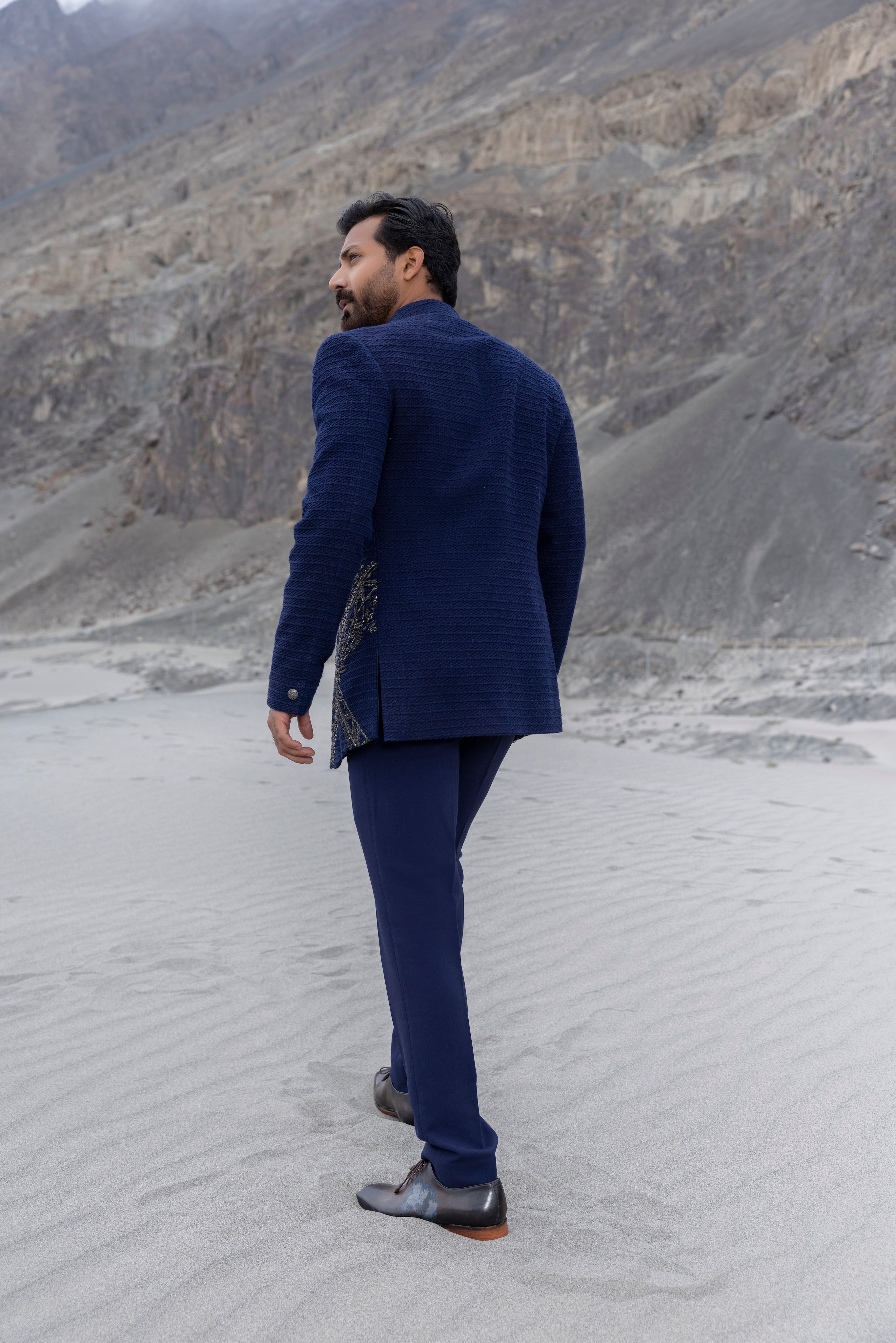 Navay Blue crochet front open indowestern jacket with contrast hand-embroidery  paired with matching crochet short kurta and a pant.