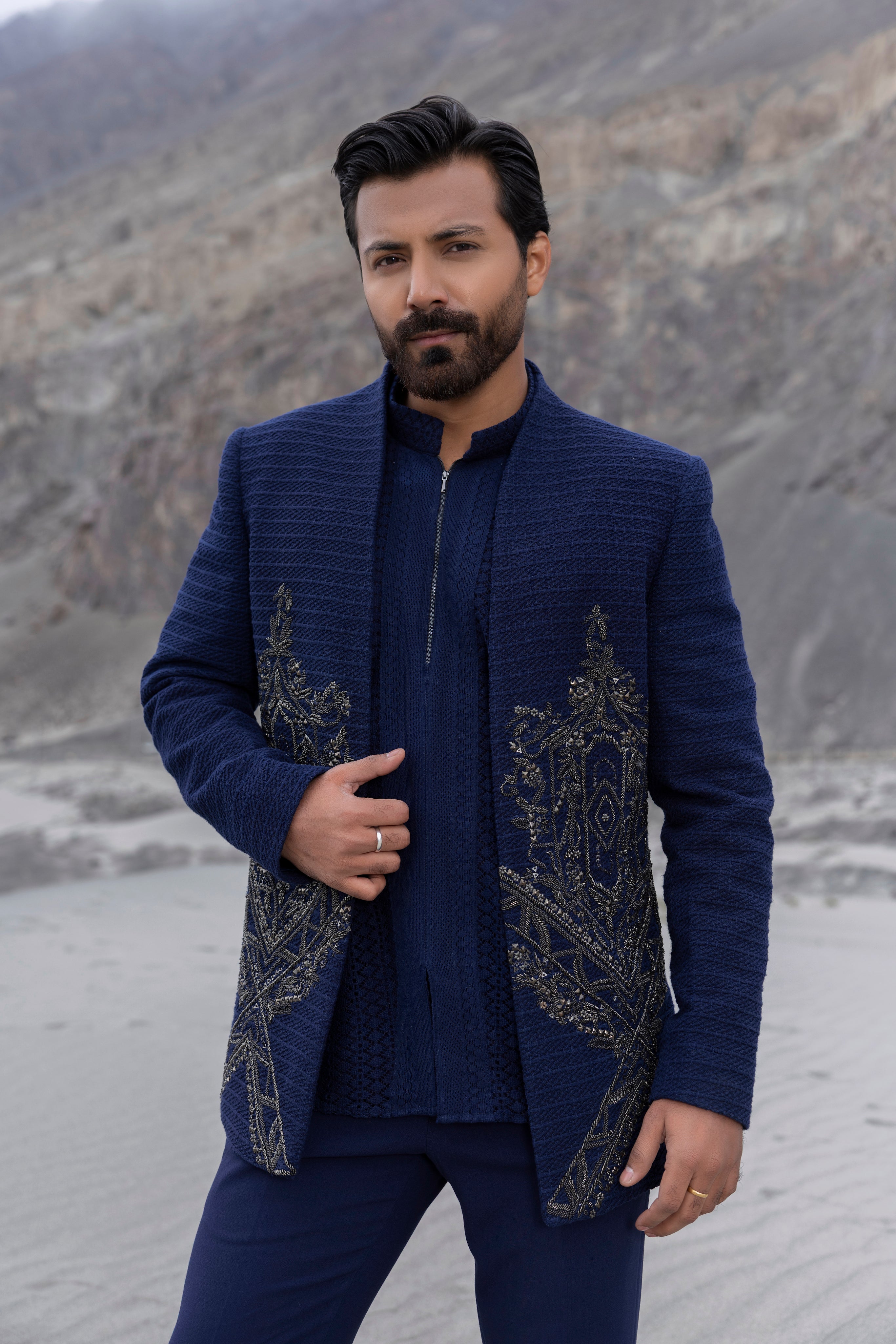 Navay Blue crochet front open indowestern jacket with contrast hand-embroidery  paired with matching crochet short kurta and a pant.