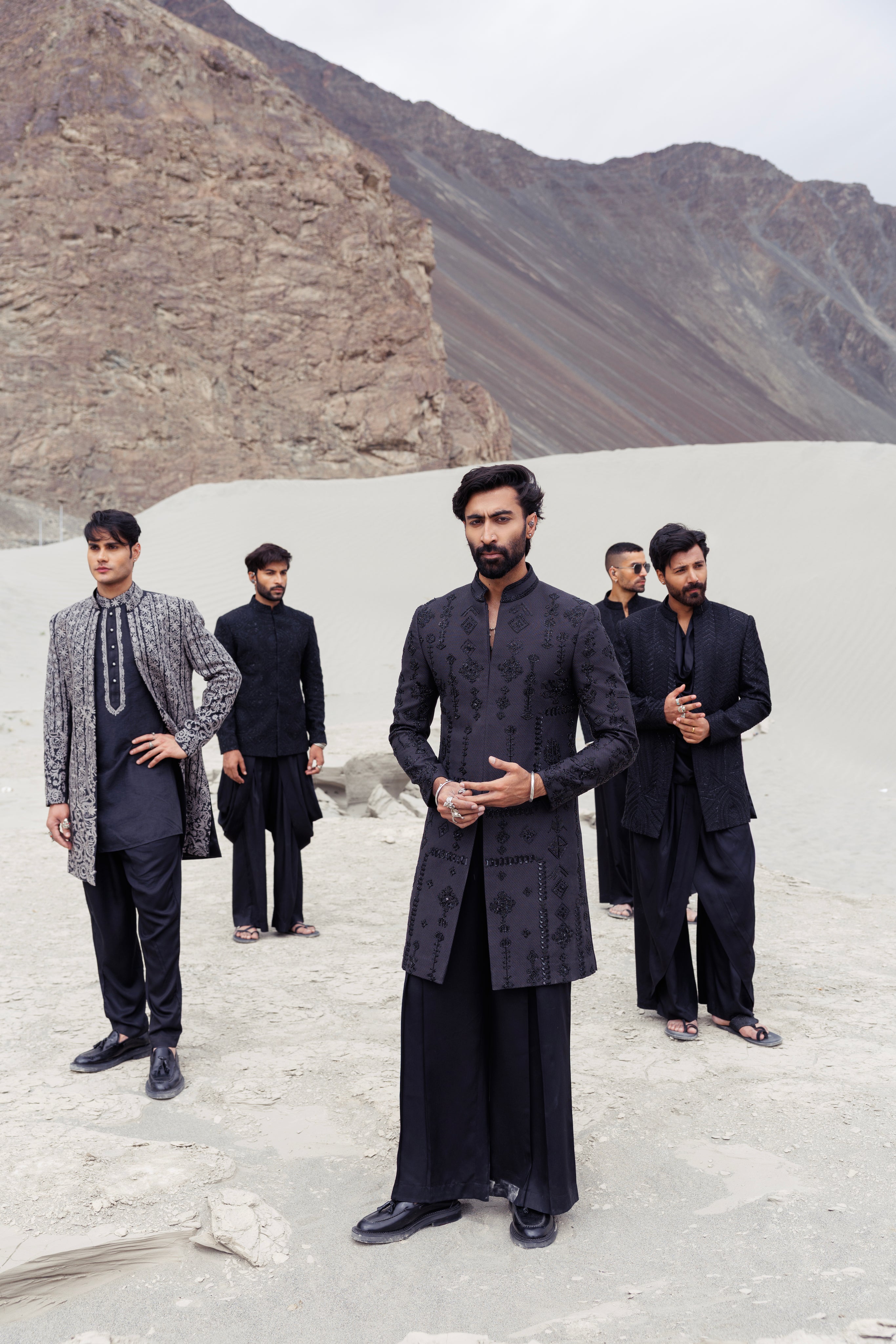 Blacklong indowestern jacket with monotone hand-embroidered motifs paired with a black plazo.