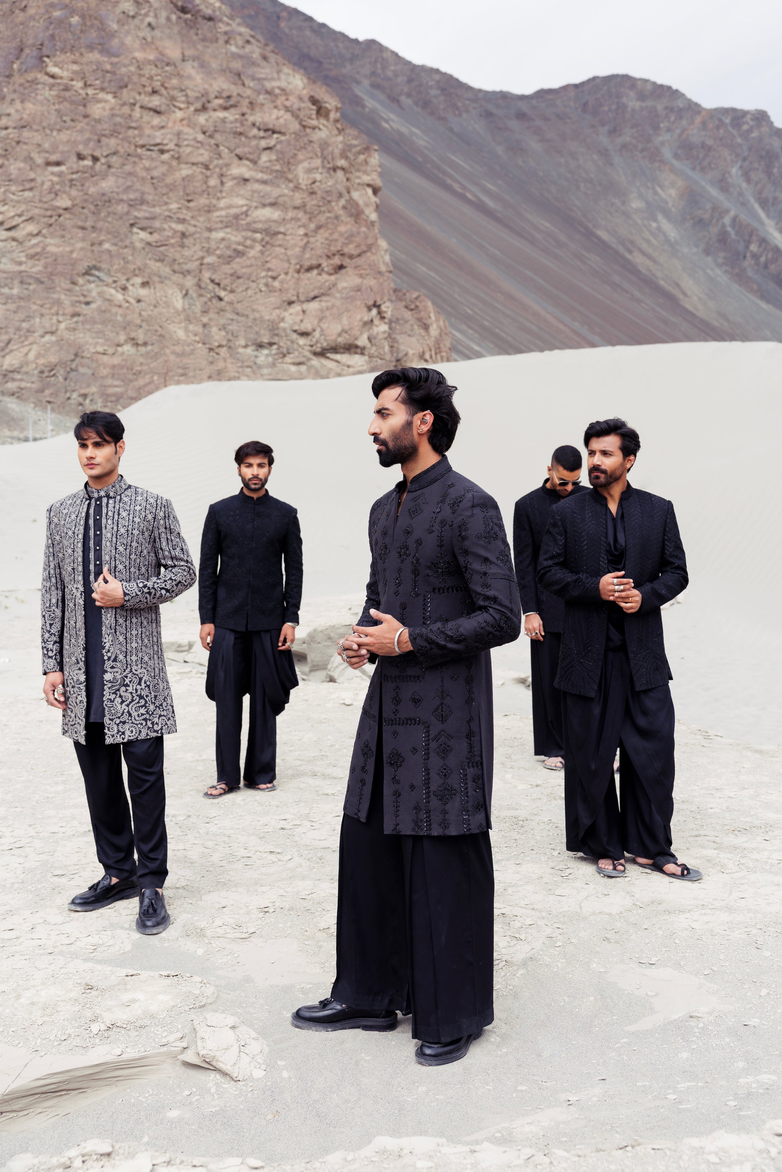 Blacklong indowestern jacket with monotone hand-embroidered motifs paired with a black plazo.