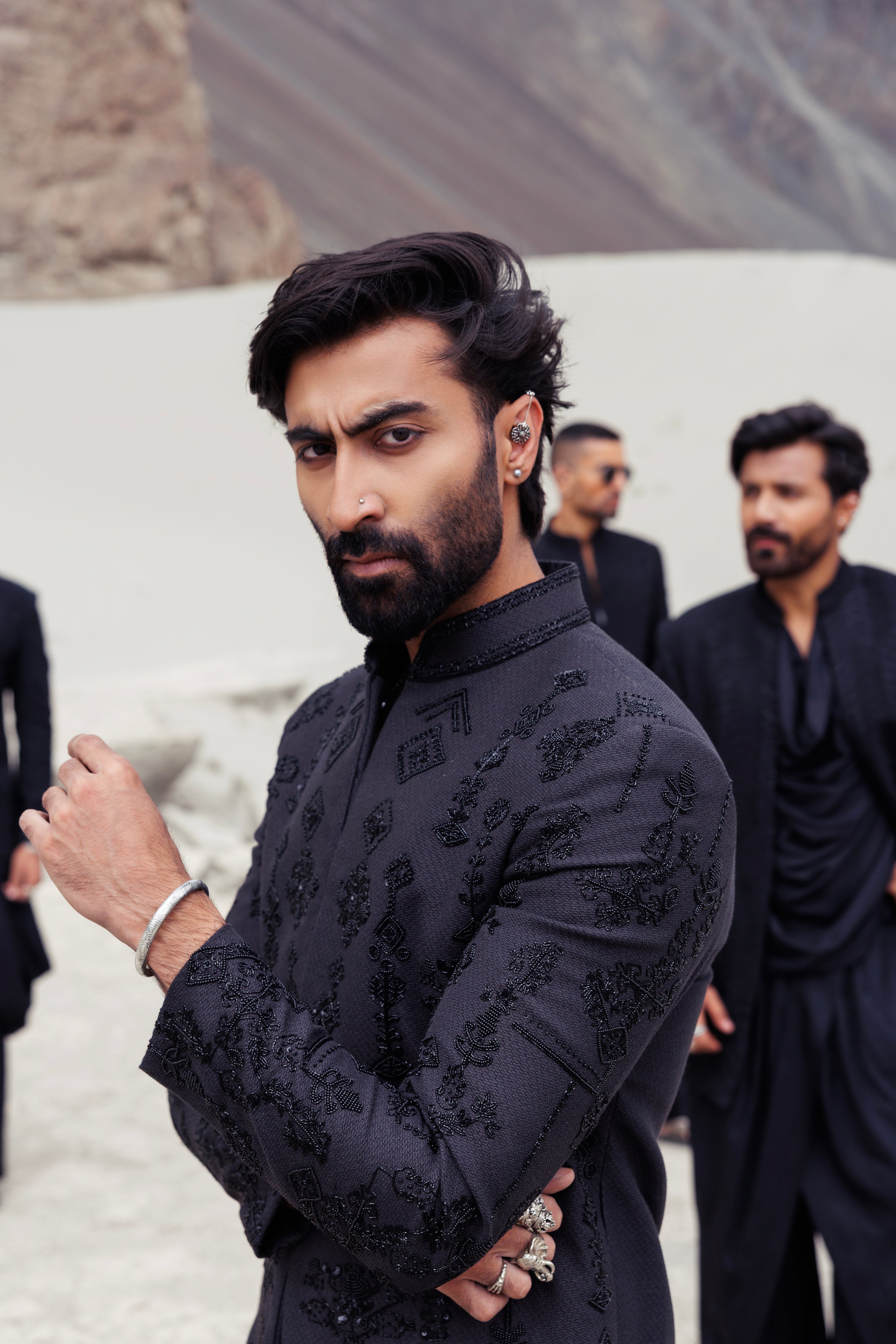 Blacklong indowestern jacket with monotone hand-embroidered motifs paired with a black plazo.