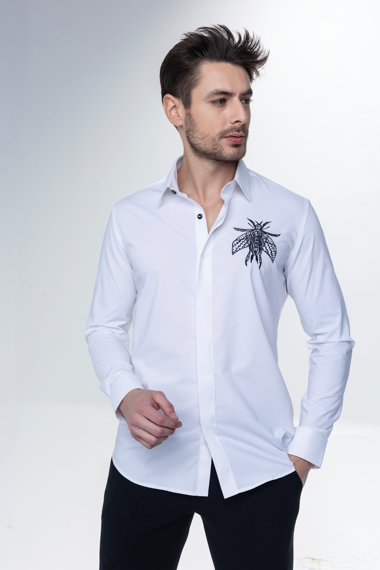 White long sleeved shirt with hand embroidered bug motif