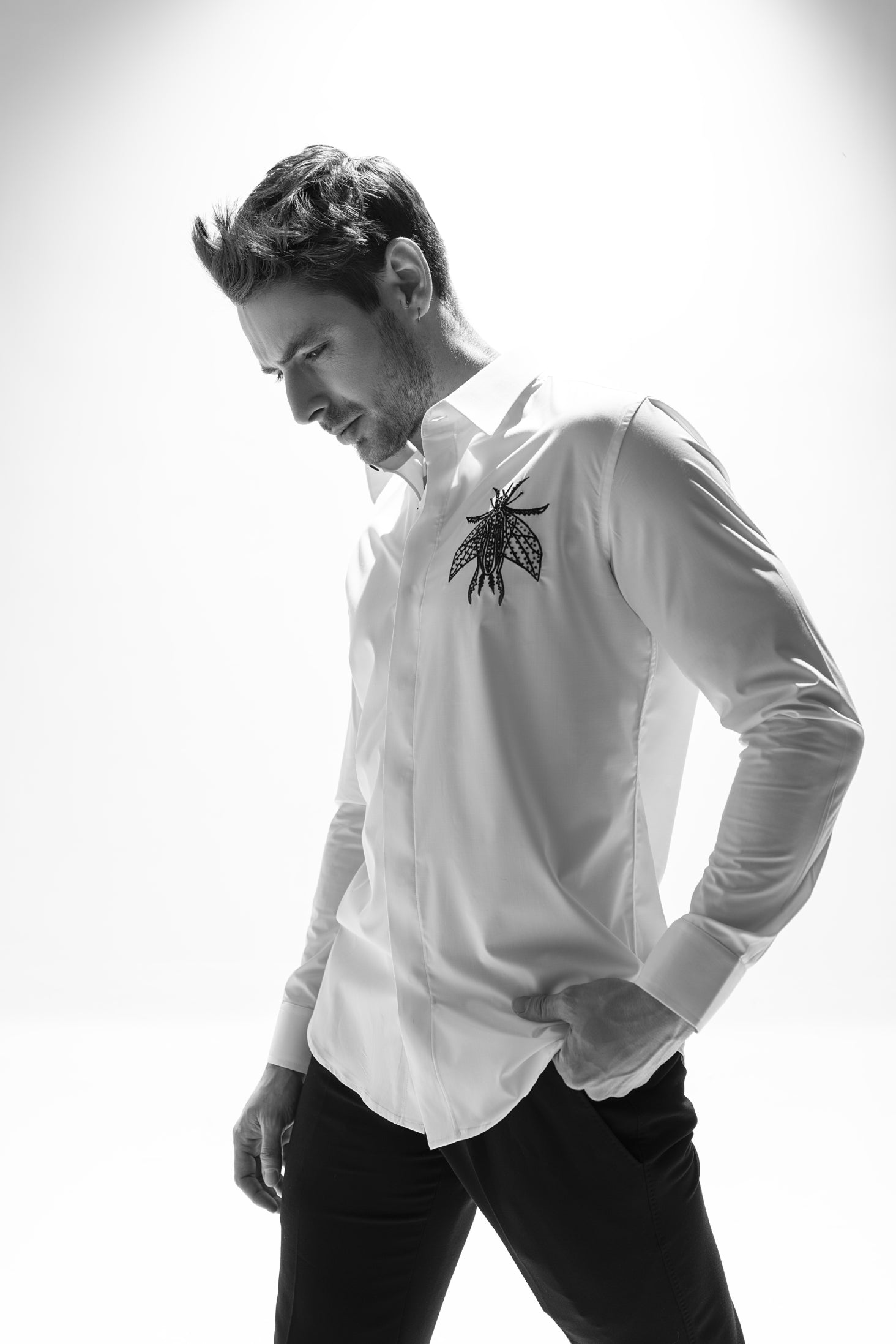 White long sleeved shirt with hand embroidered bug motif