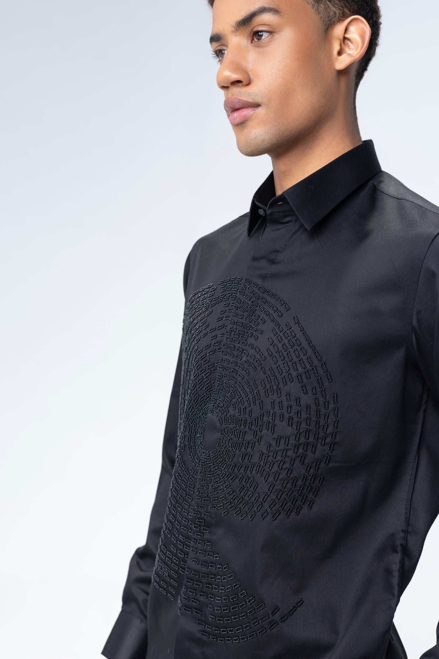 Black shirt with hand-embroidered circular