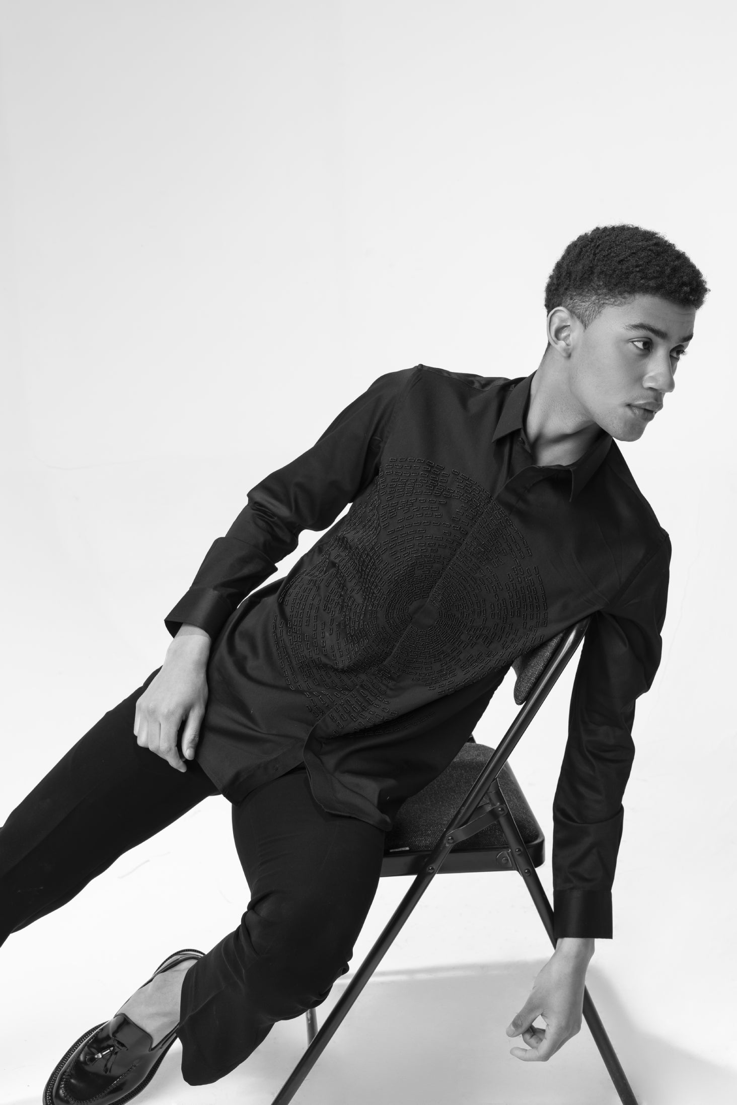 Black shirt with hand-embroidered circular