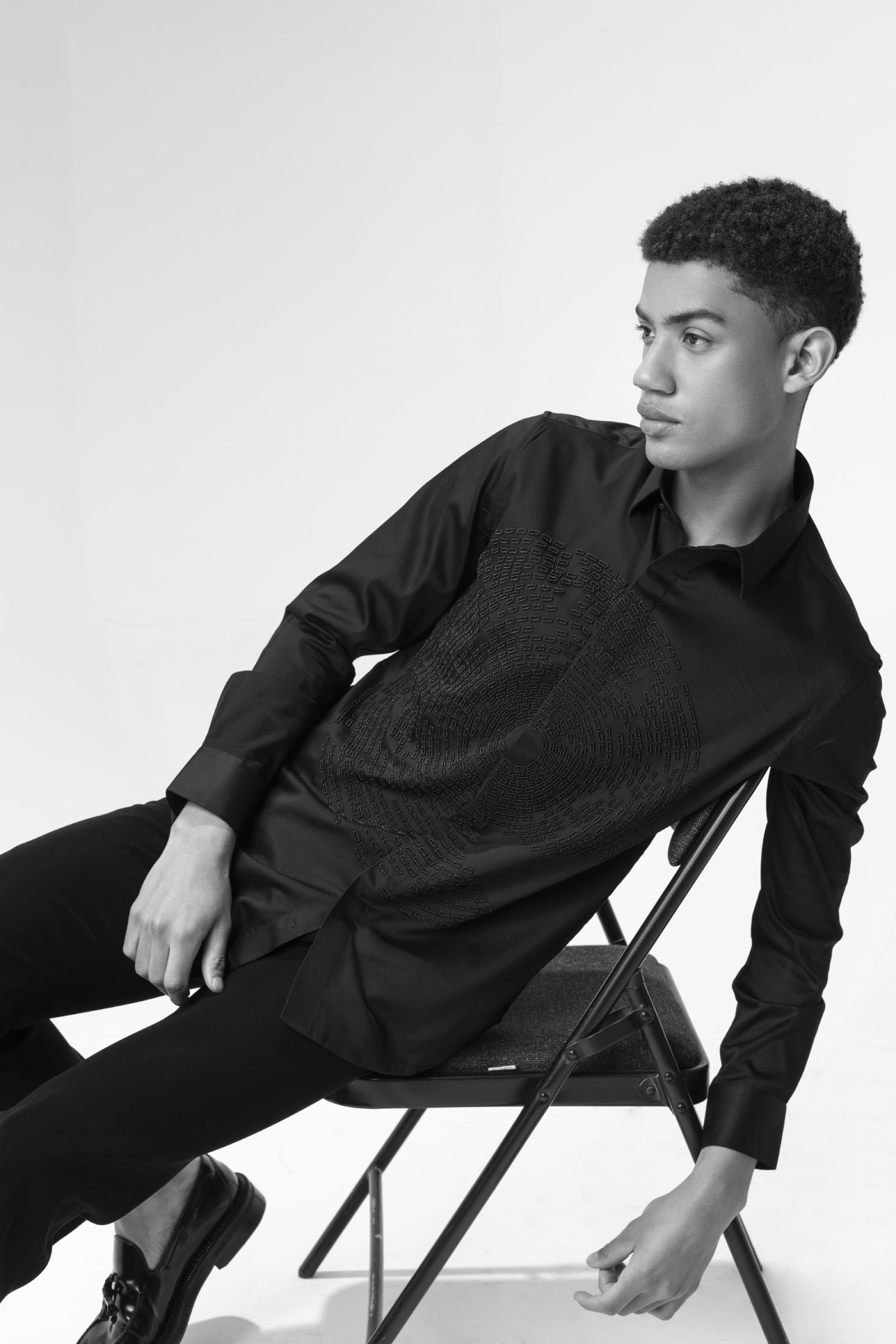 Black shirt with hand-embroidered circular