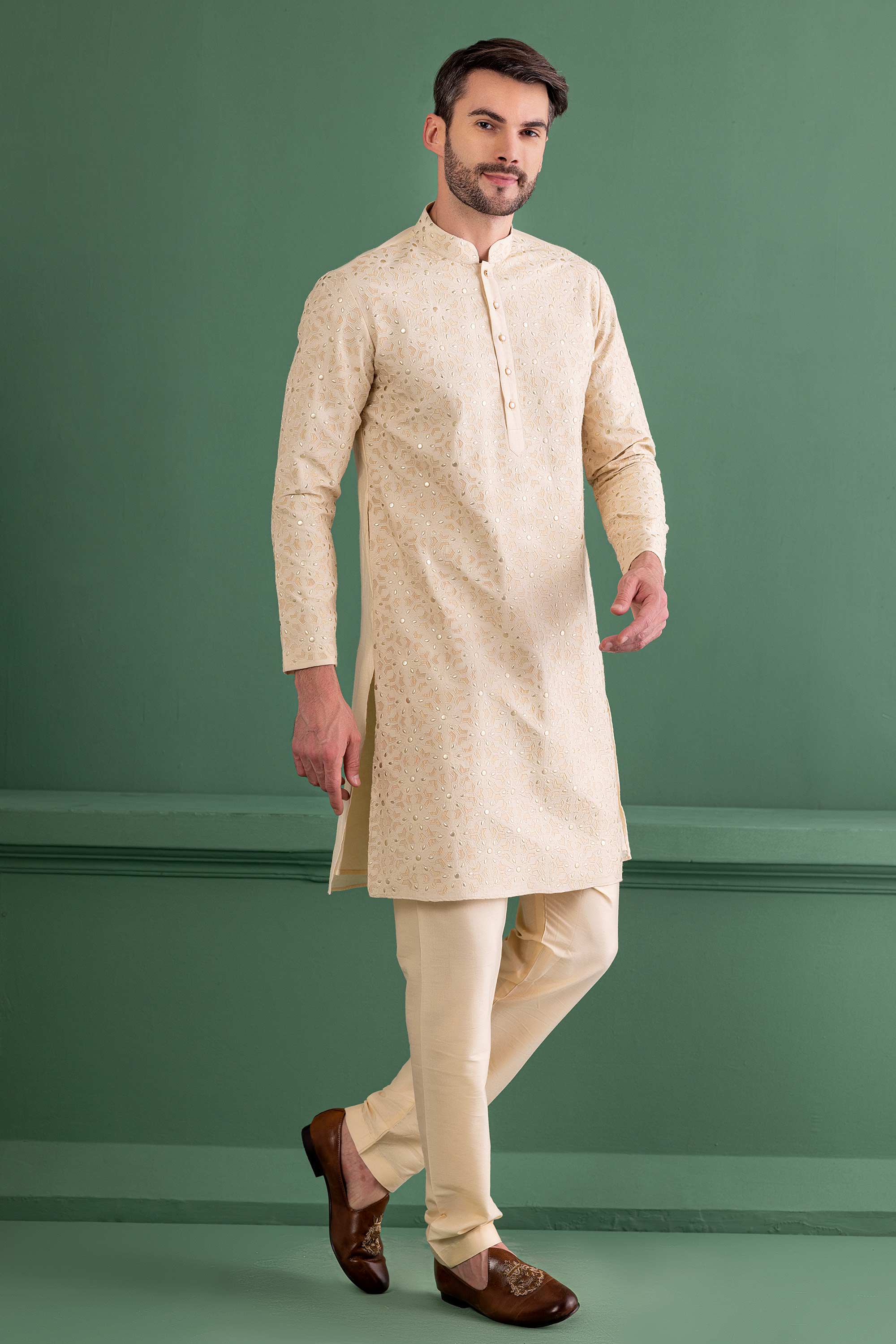 cream kurta with metal & patch work