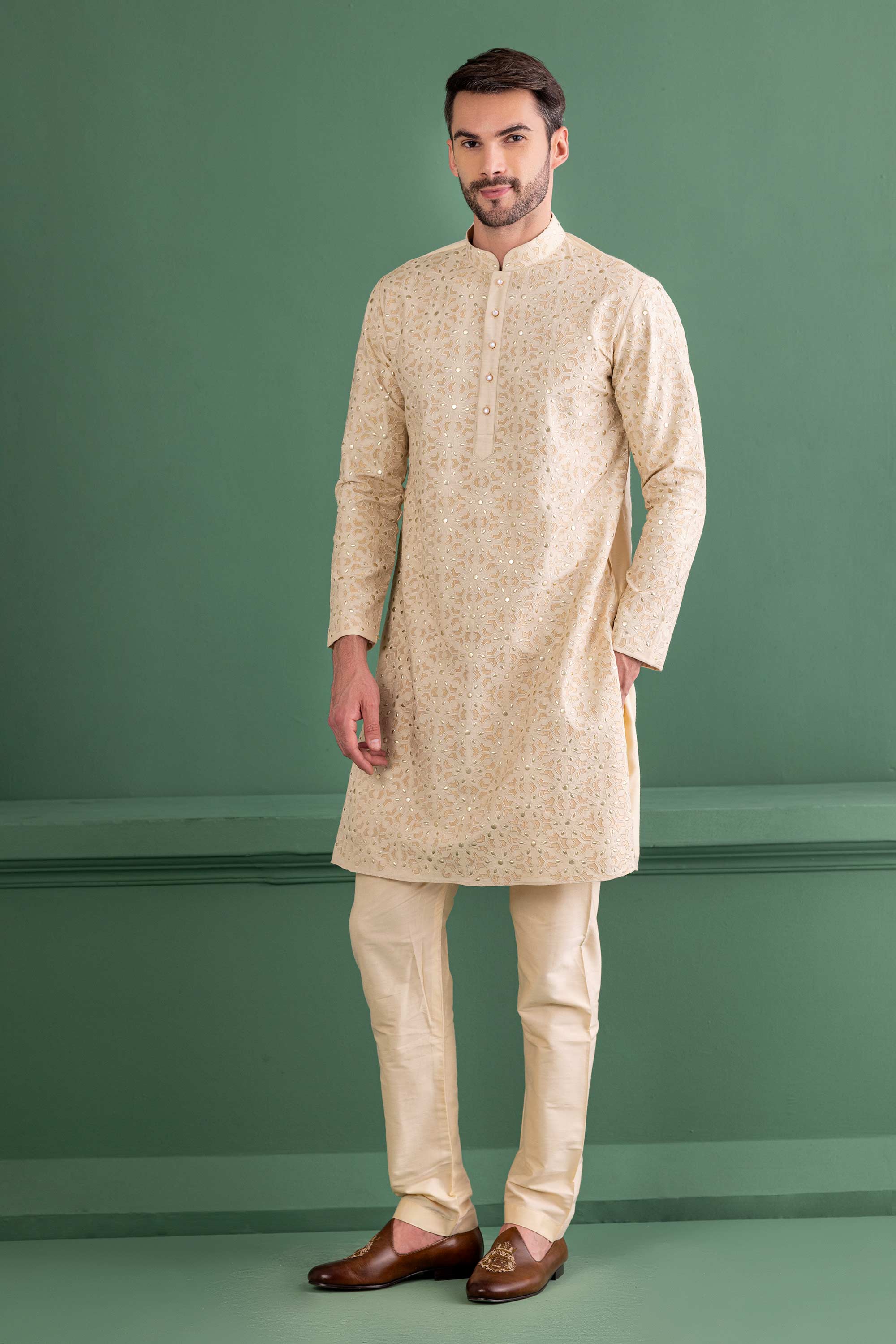 cream kurta with metal & patch work