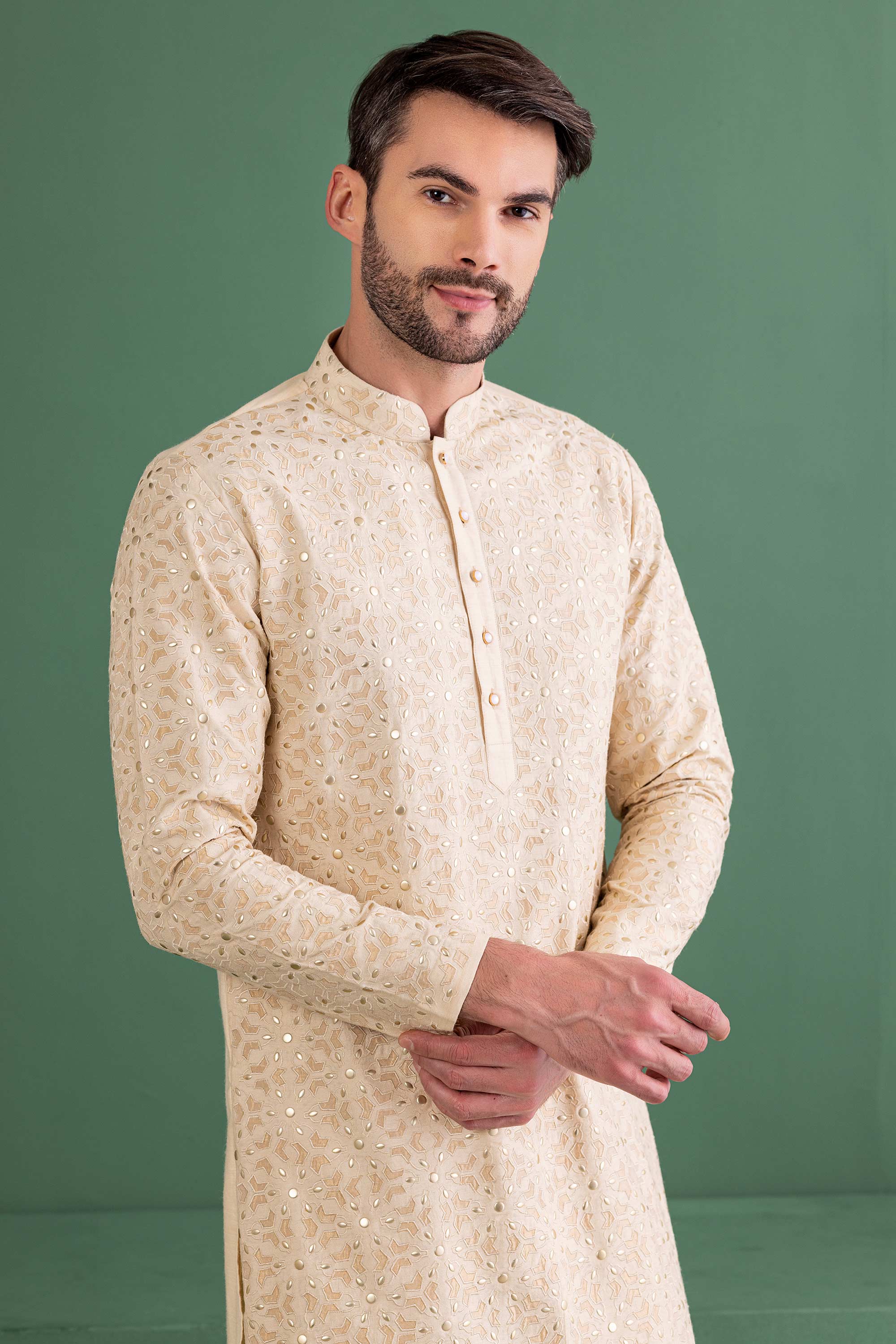 cream kurta with metal & patch work
