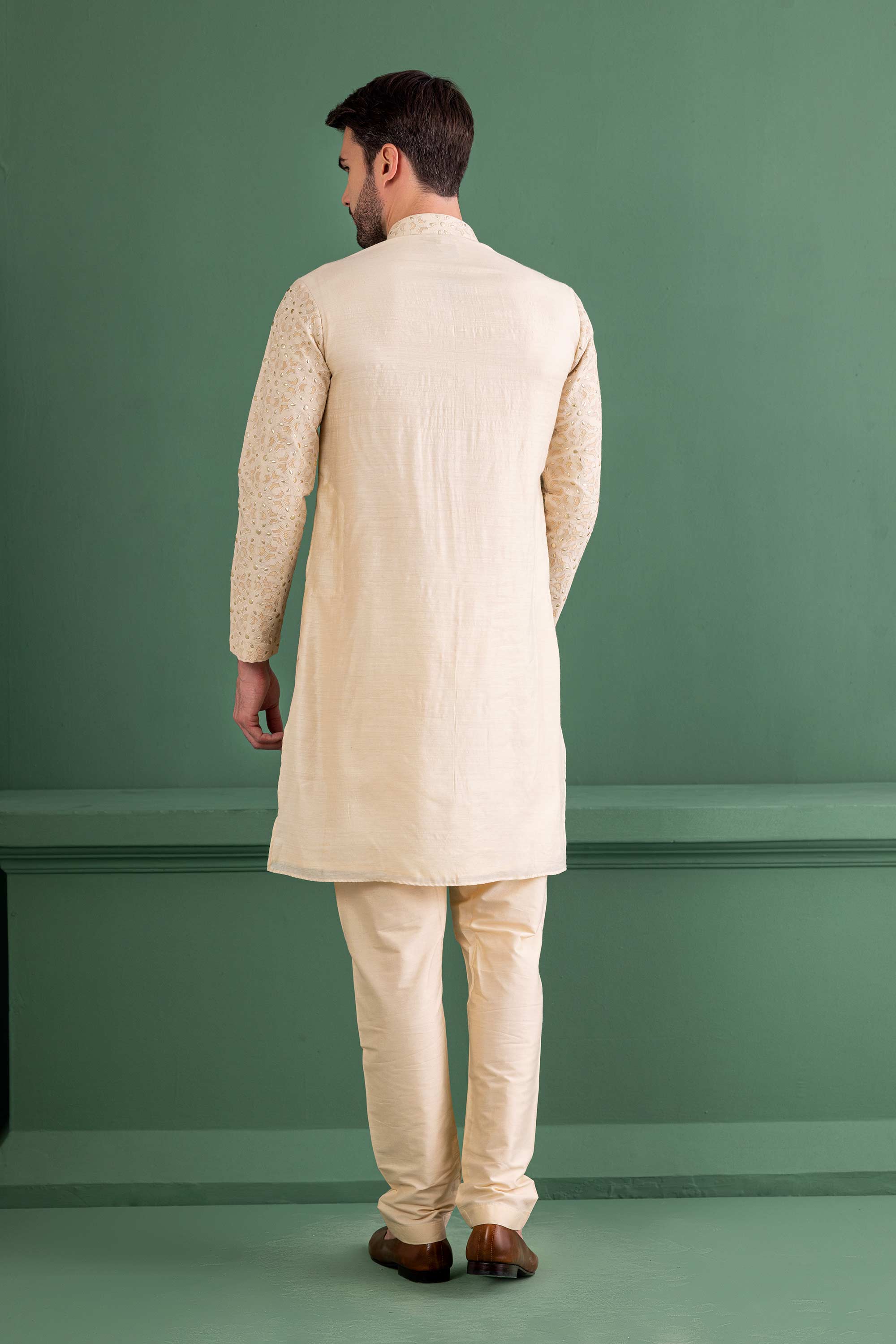 cream kurta with metal & patch work