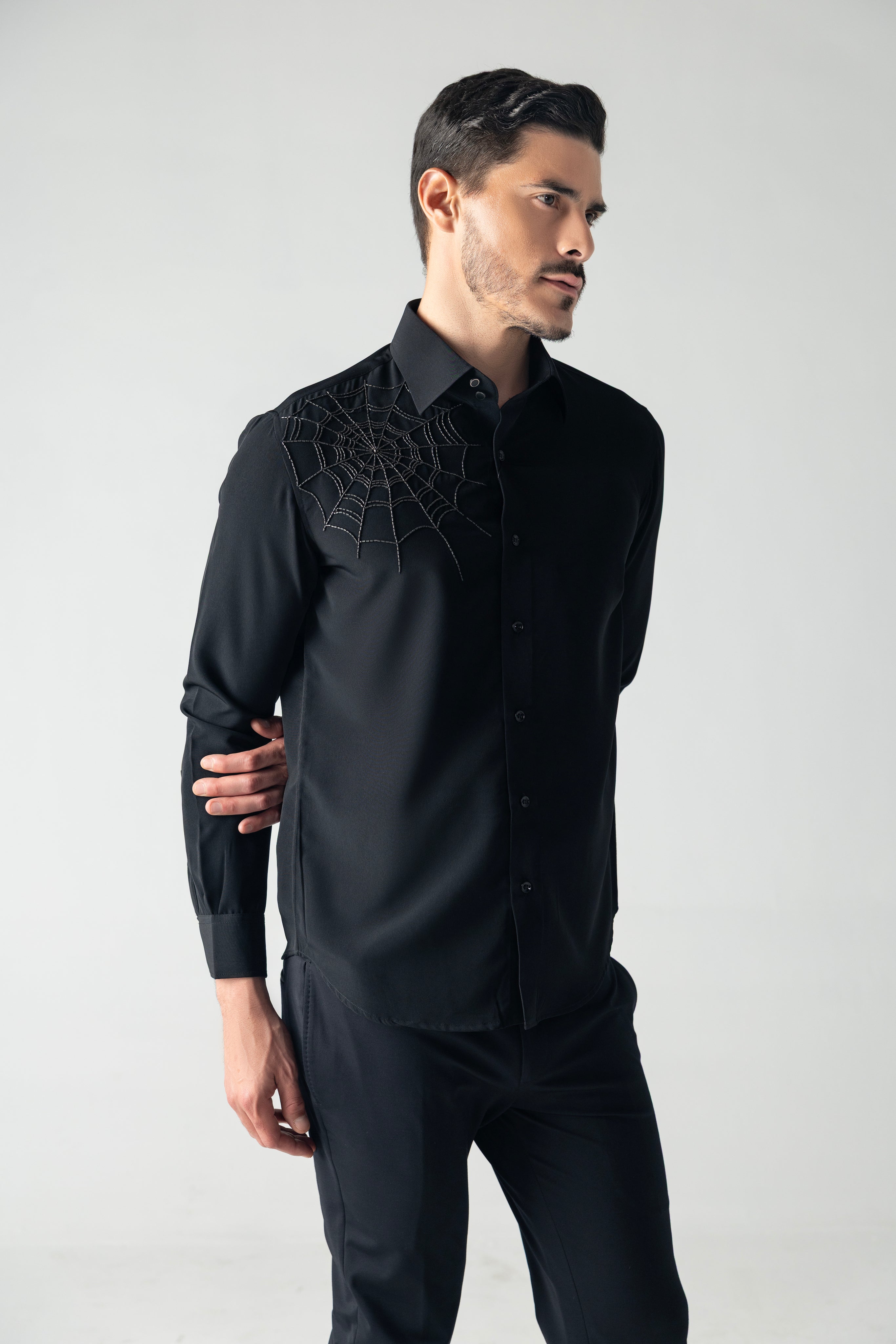 Black shirt with hand-embroidered spider web motif