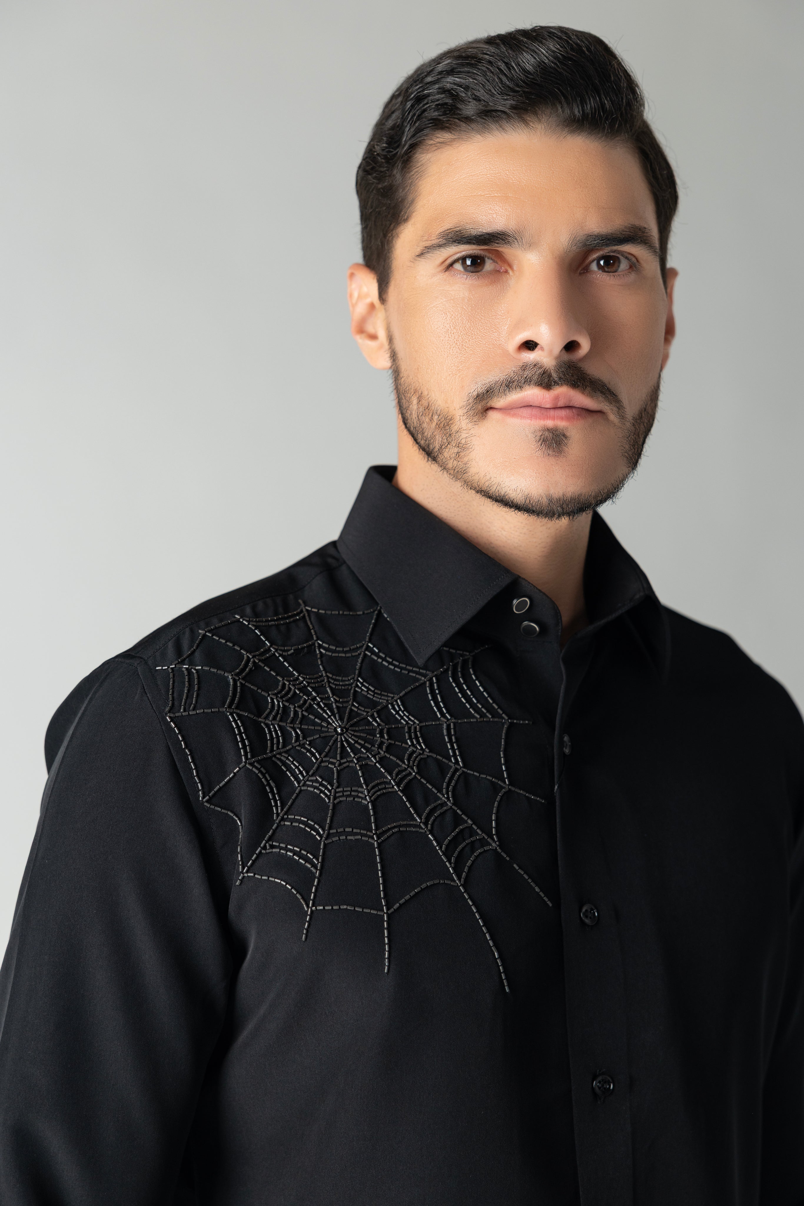 Black shirt with hand-embroidered spider web motif
