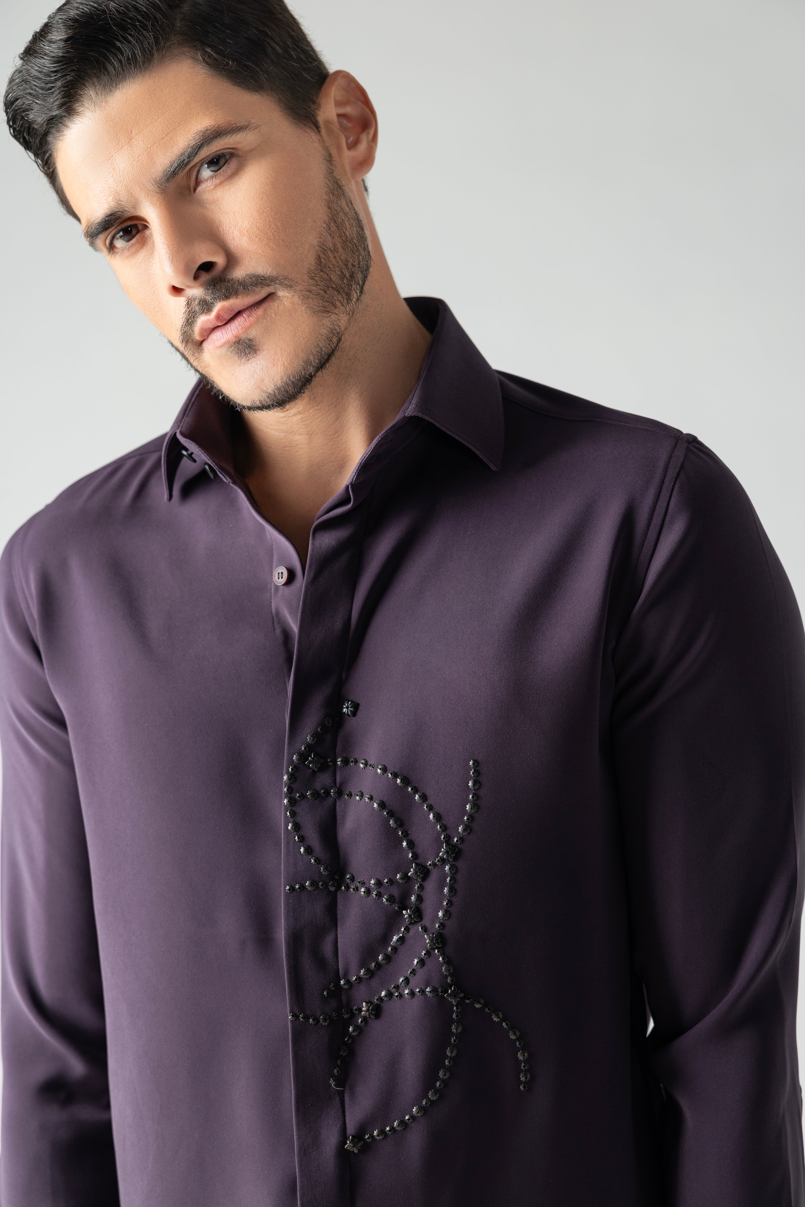 Purple shirt with abstract hand-embroidered metal motif
