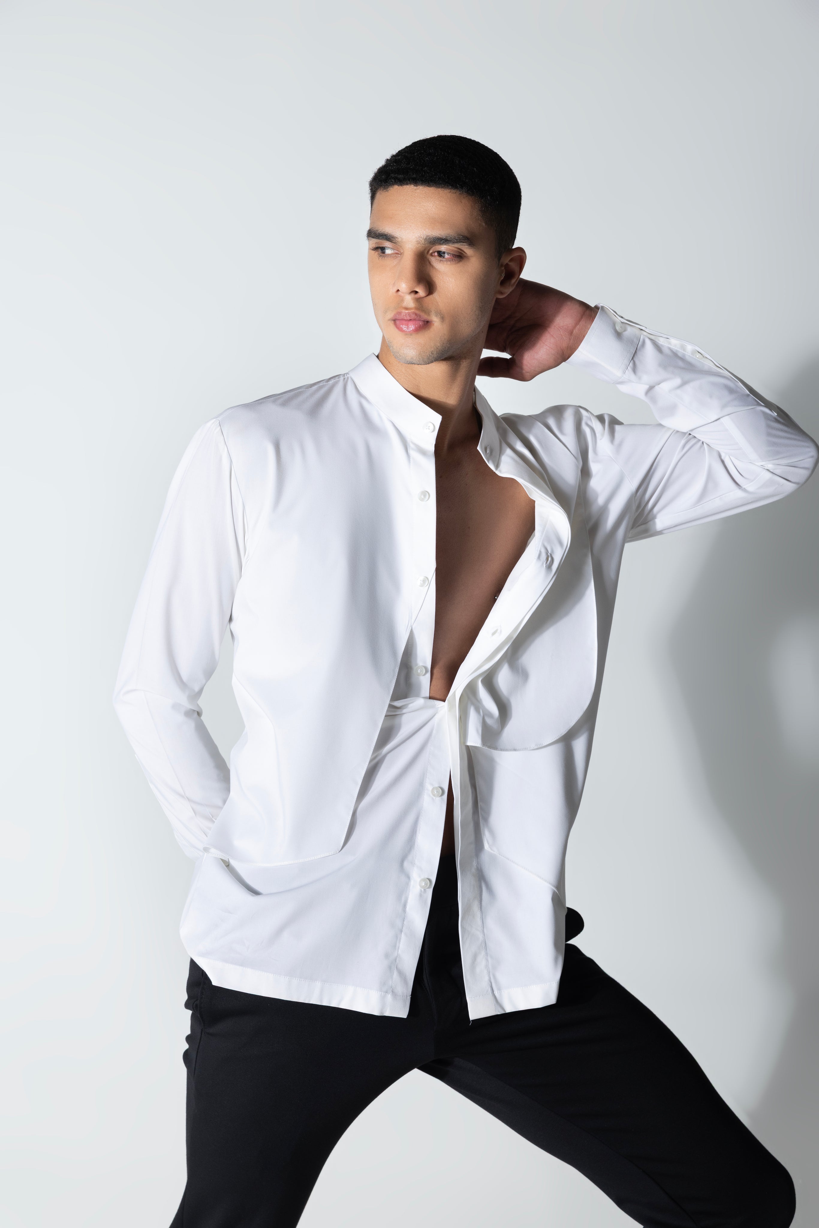 White shirt with asymmetrical cuts & drapes