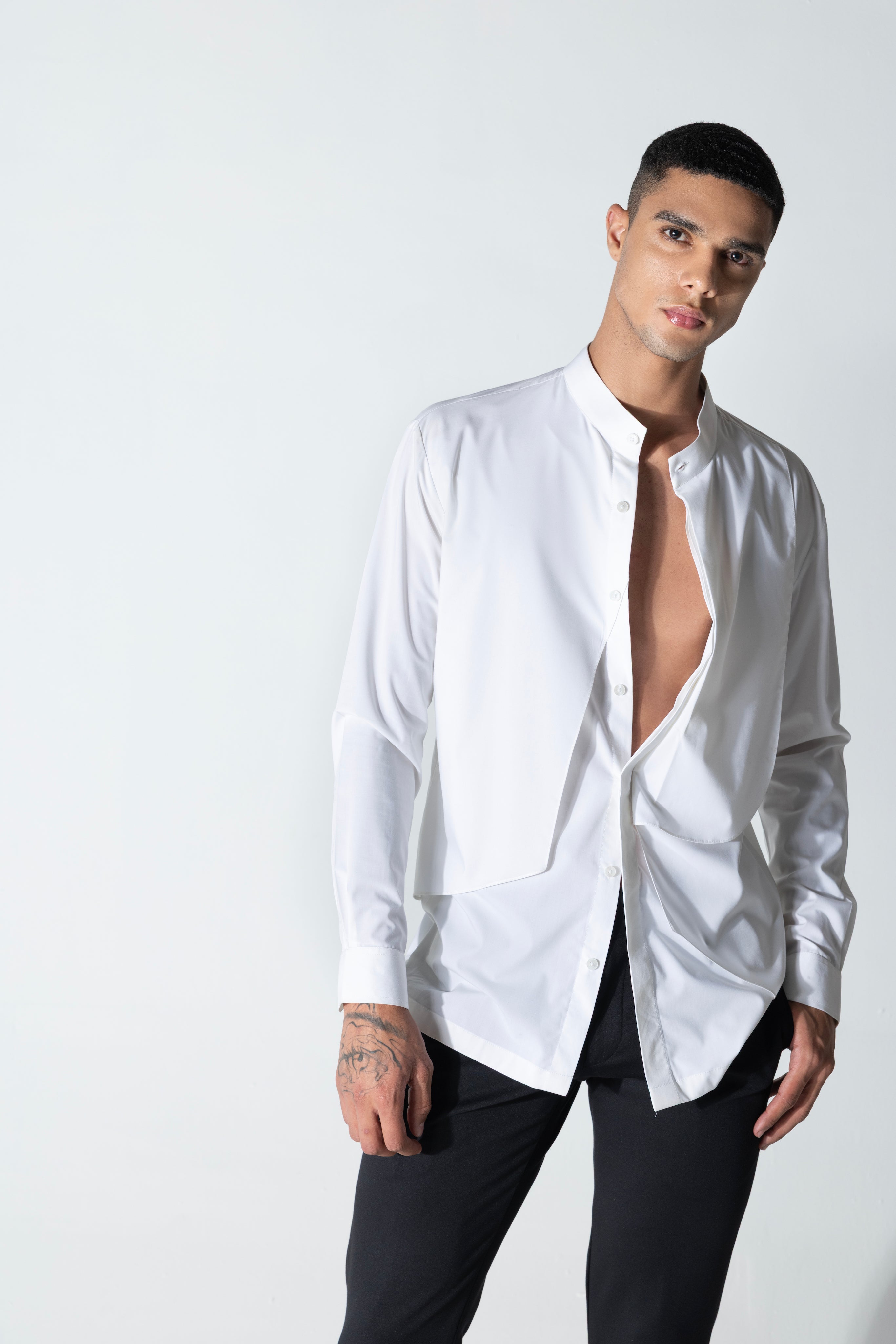 White shirt with asymmetrical cuts & drapes