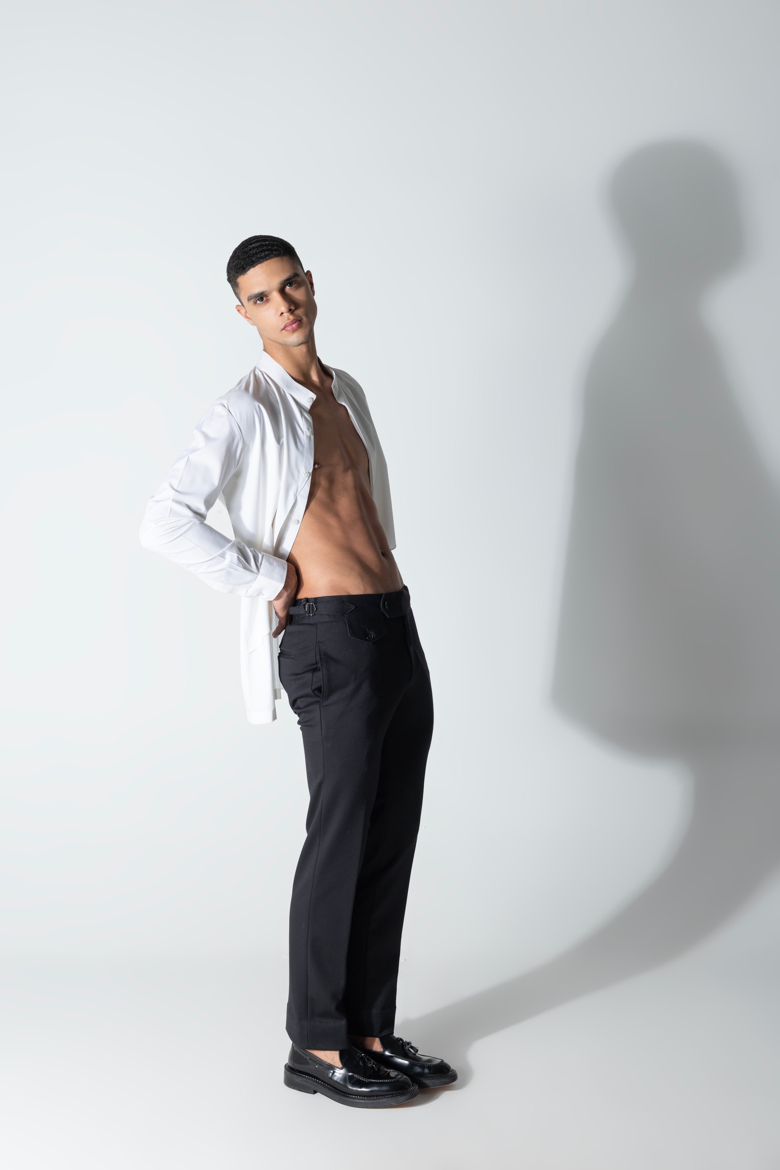 White shirt with asymmetrical cuts & drapes