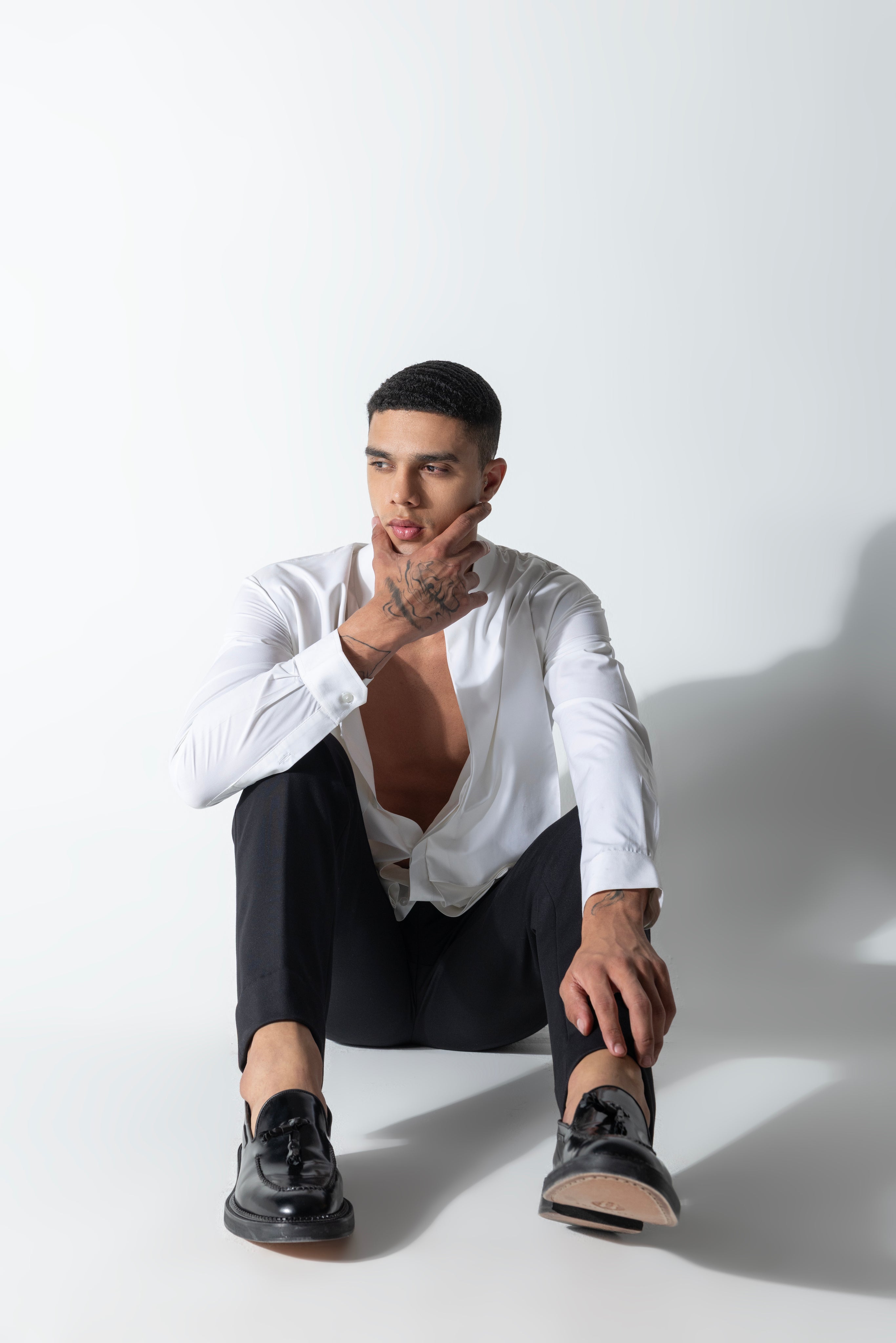 White shirt with asymmetrical cuts & drapes