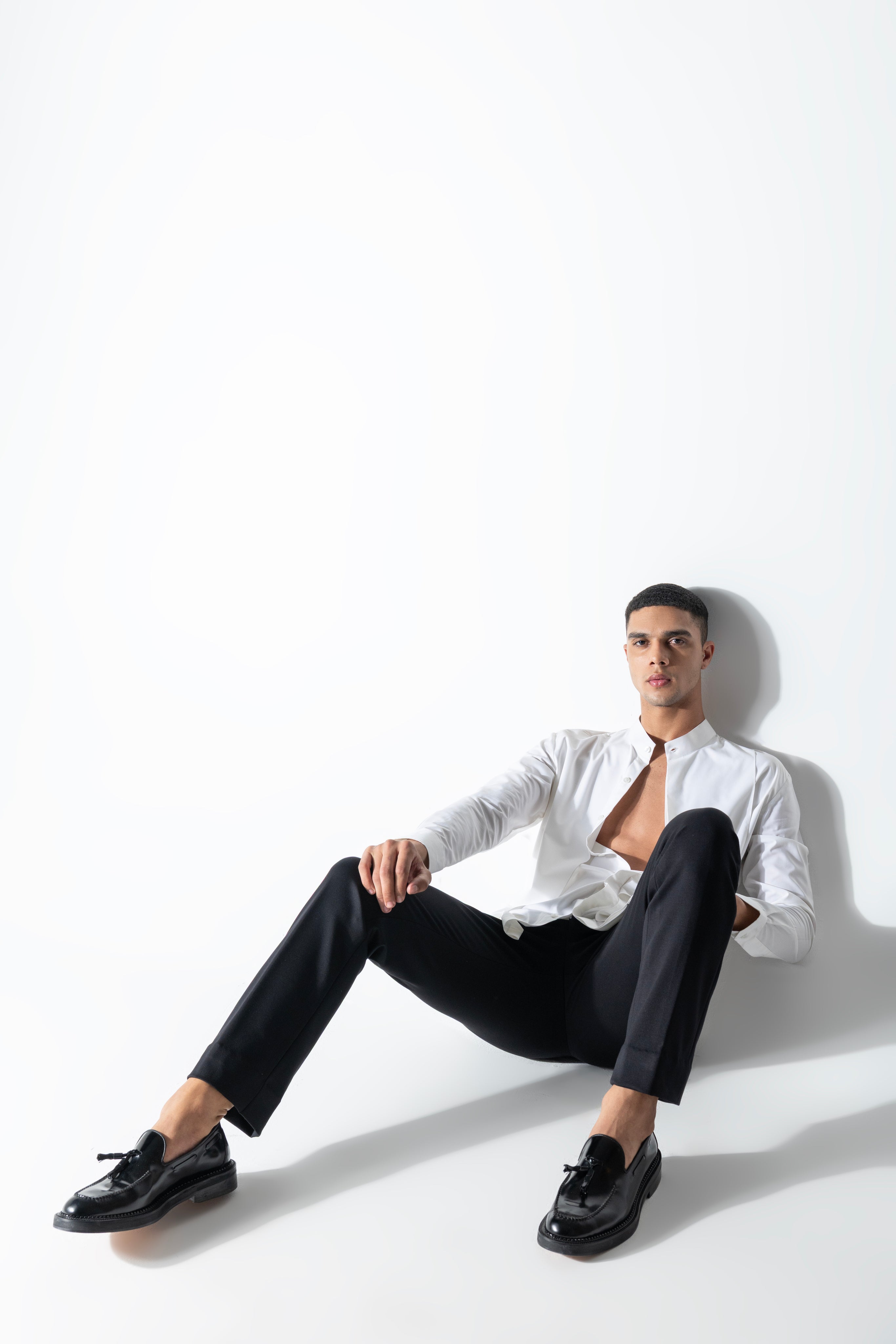 White shirt with asymmetrical cuts & drapes