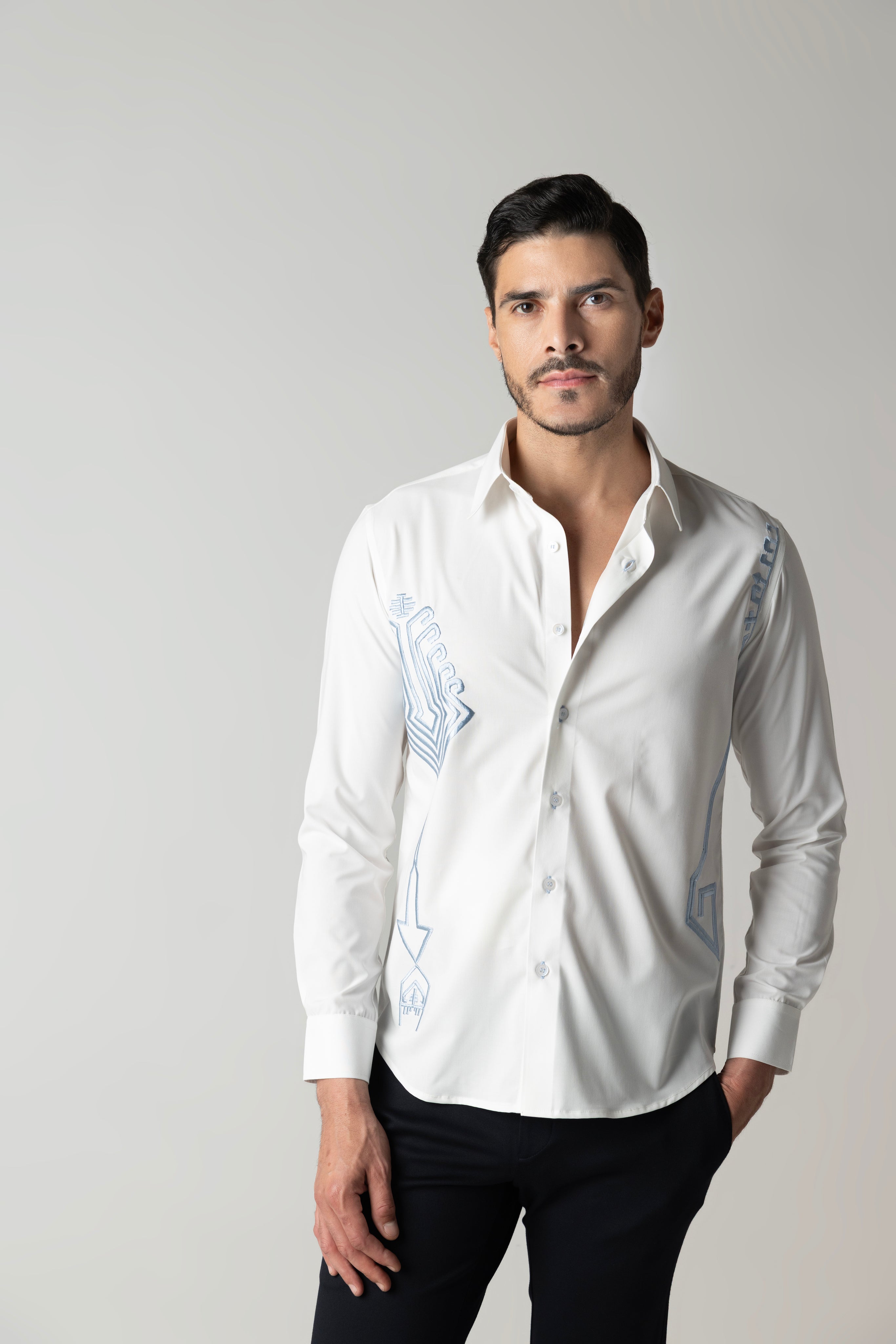 White shirt with embroidered sky blue geometrical motifs