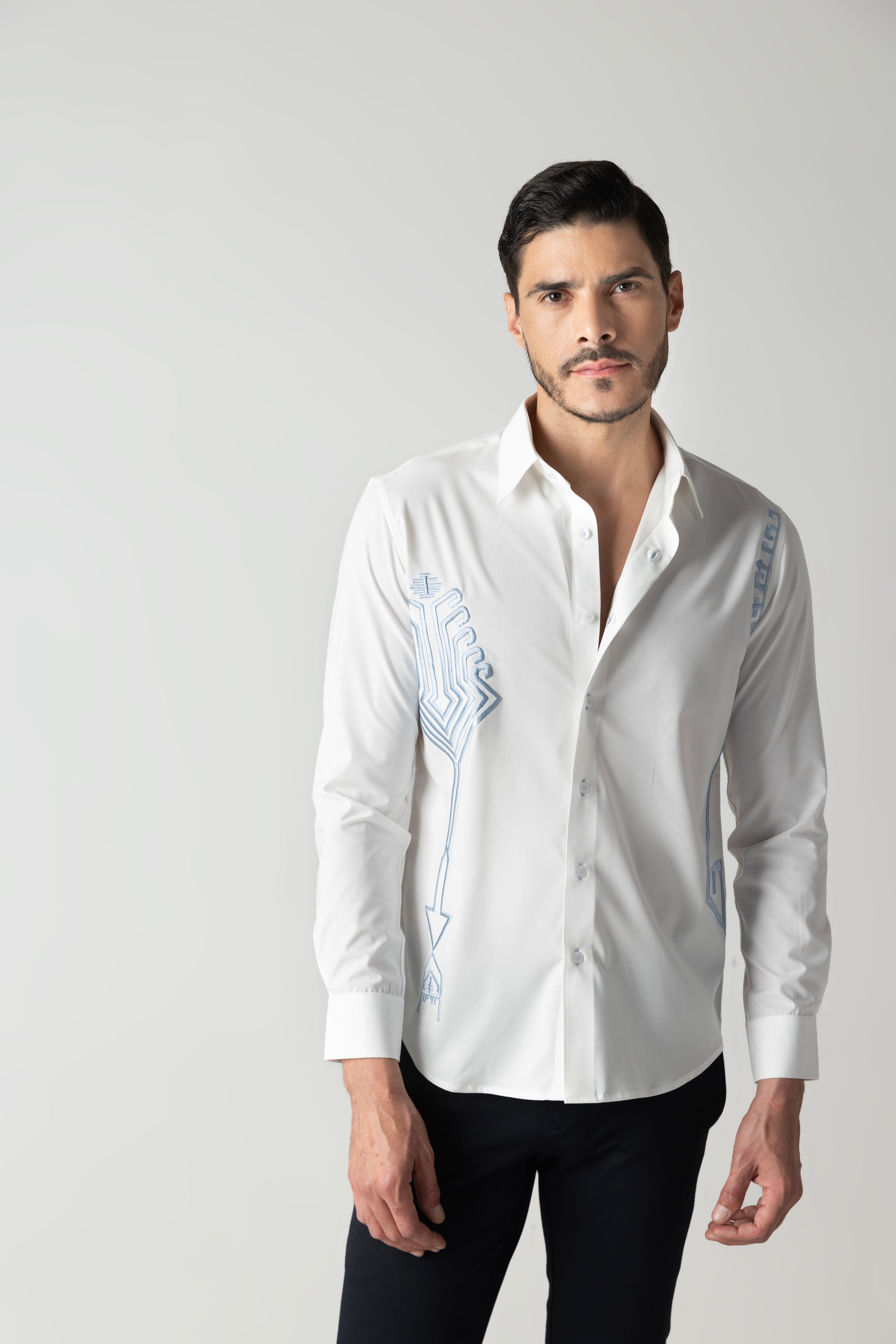 White shirt with embroidered sky blue geometrical motifs