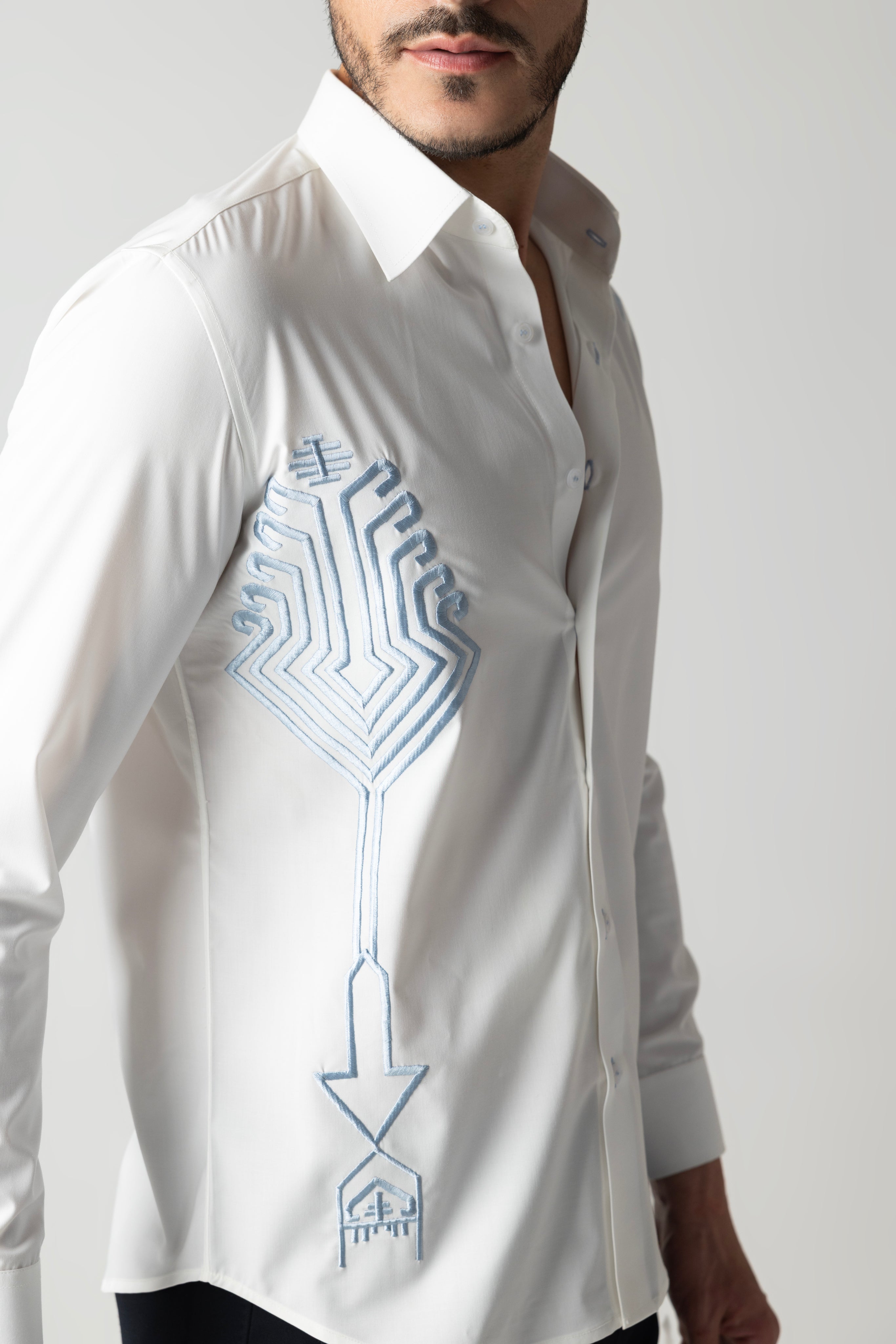 White shirt with embroidered sky blue geometrical motifs