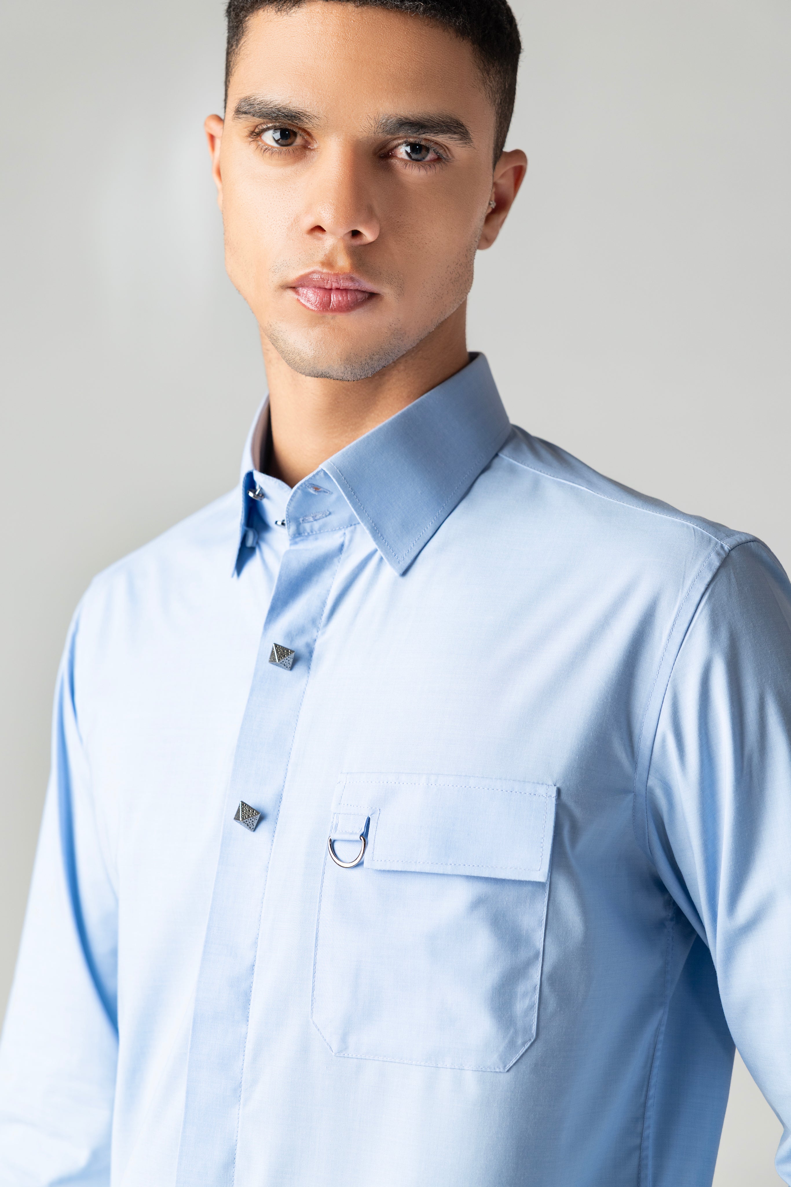 Sky blue with metallic buttons, patch pocket & buckle detailing