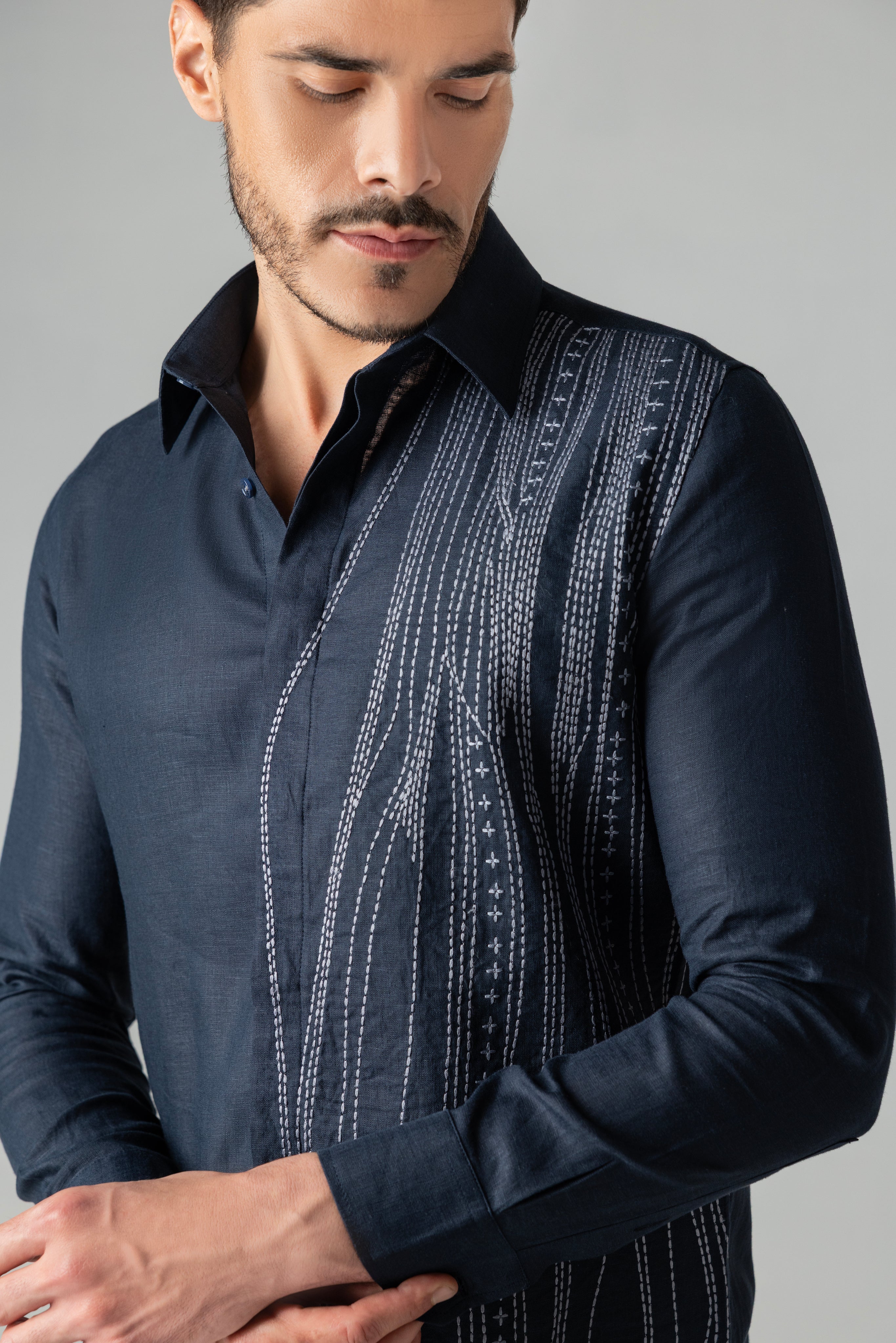 Navy blue linen shirt with wave-inspired contrast embroidery