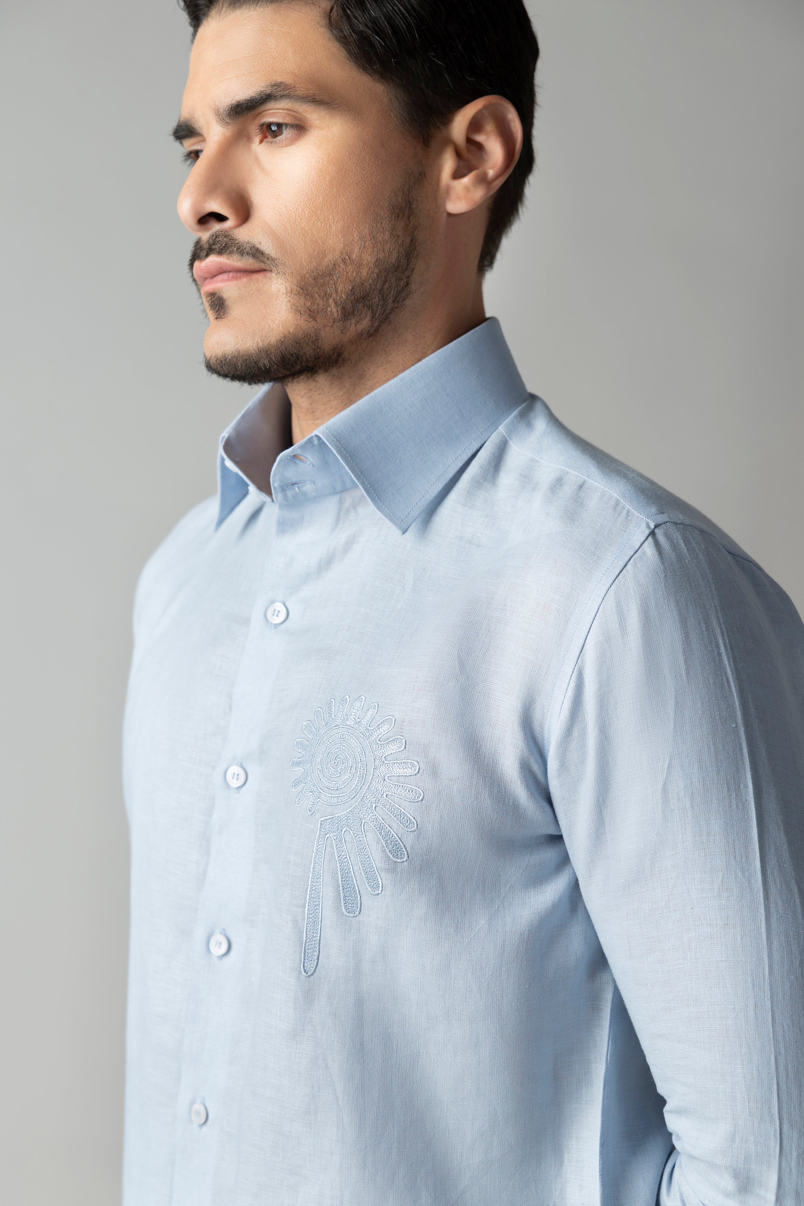 Sky blue linen shirt with embroidered floral motif