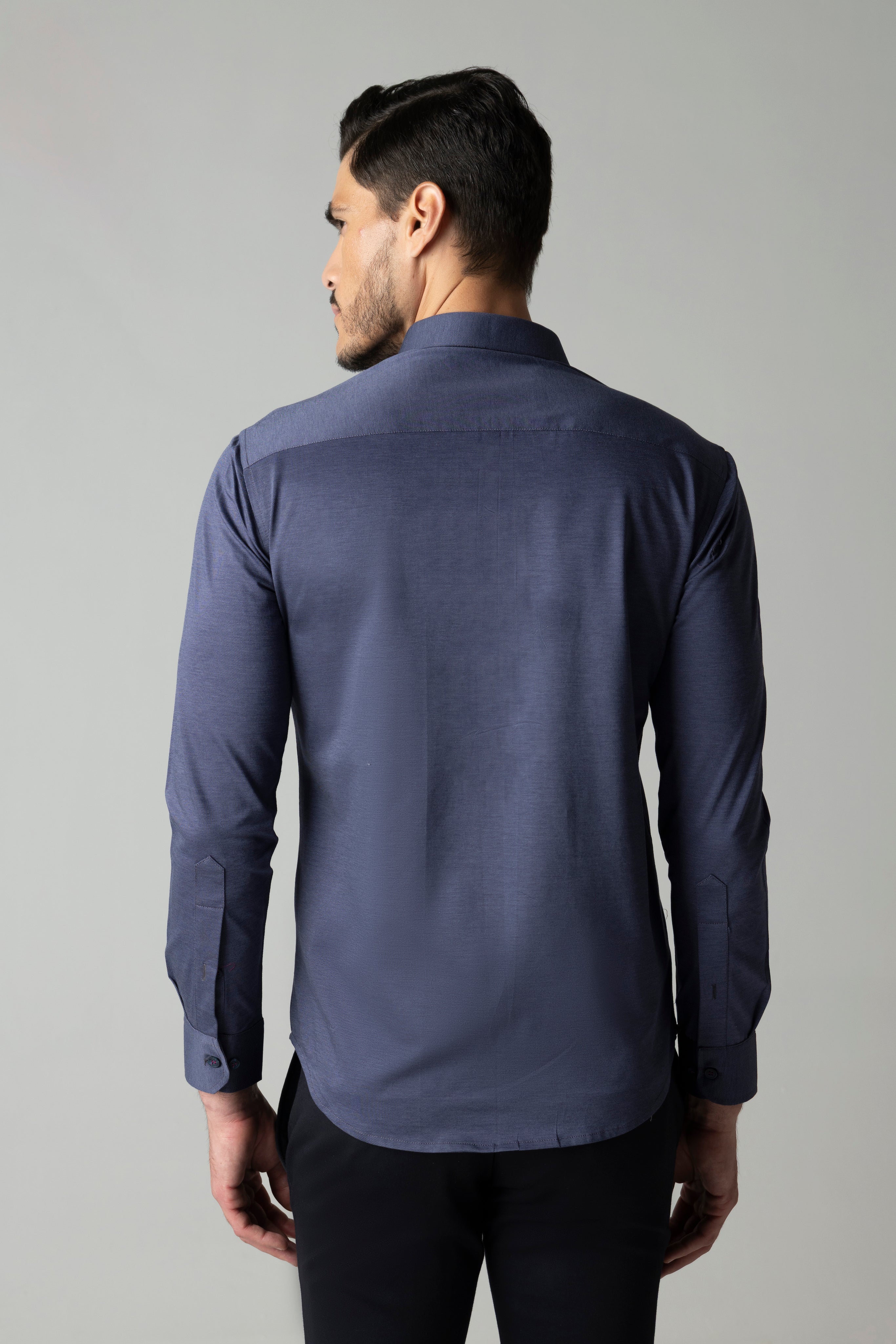 Navy blue knit shirt with embroidered multi-coloured Reindeer motif