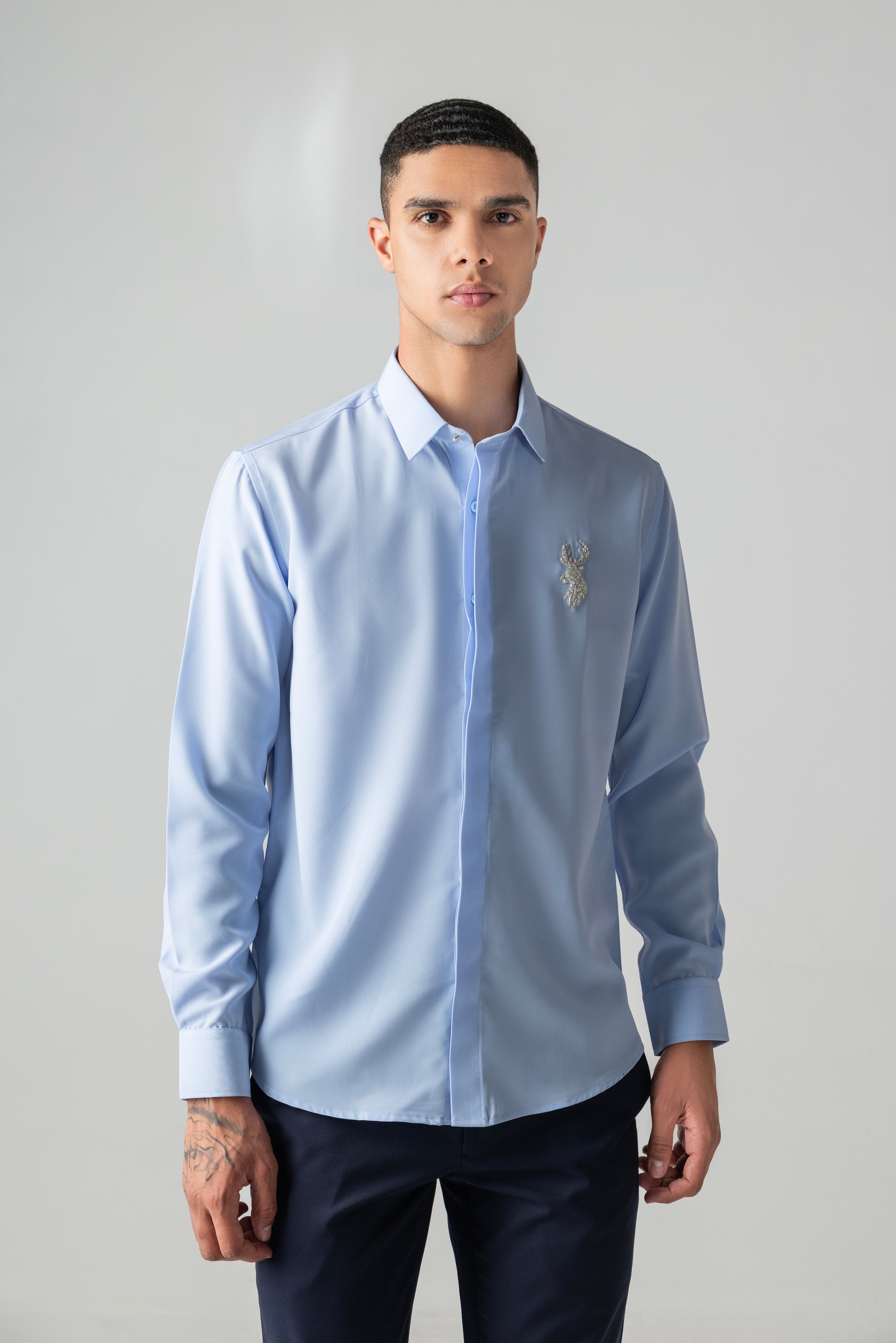 Sky blue shirt with metallic hand-embroidered Reindeer motif