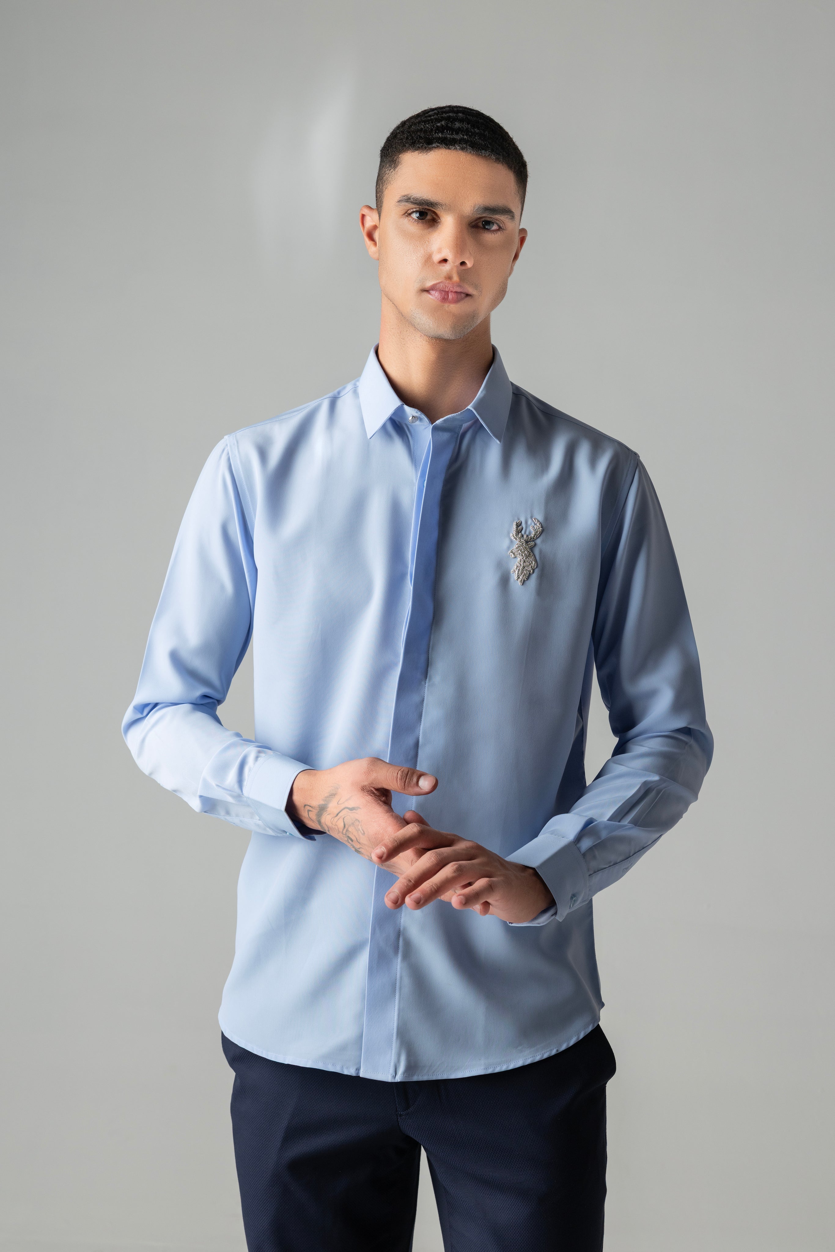 Sky blue shirt with metallic hand-embroidered Reindeer motif