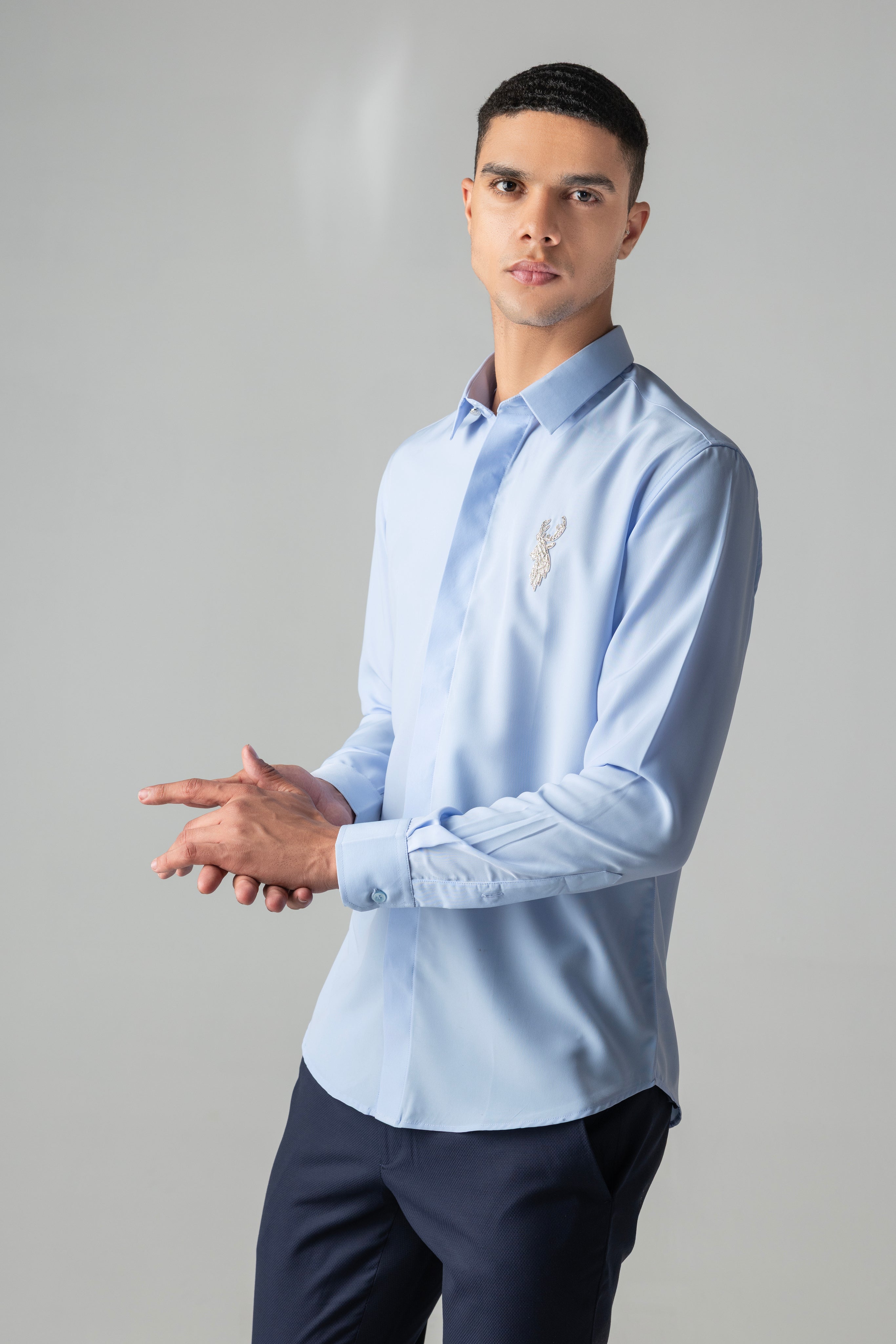 Sky blue shirt with metallic hand-embroidered Reindeer motif