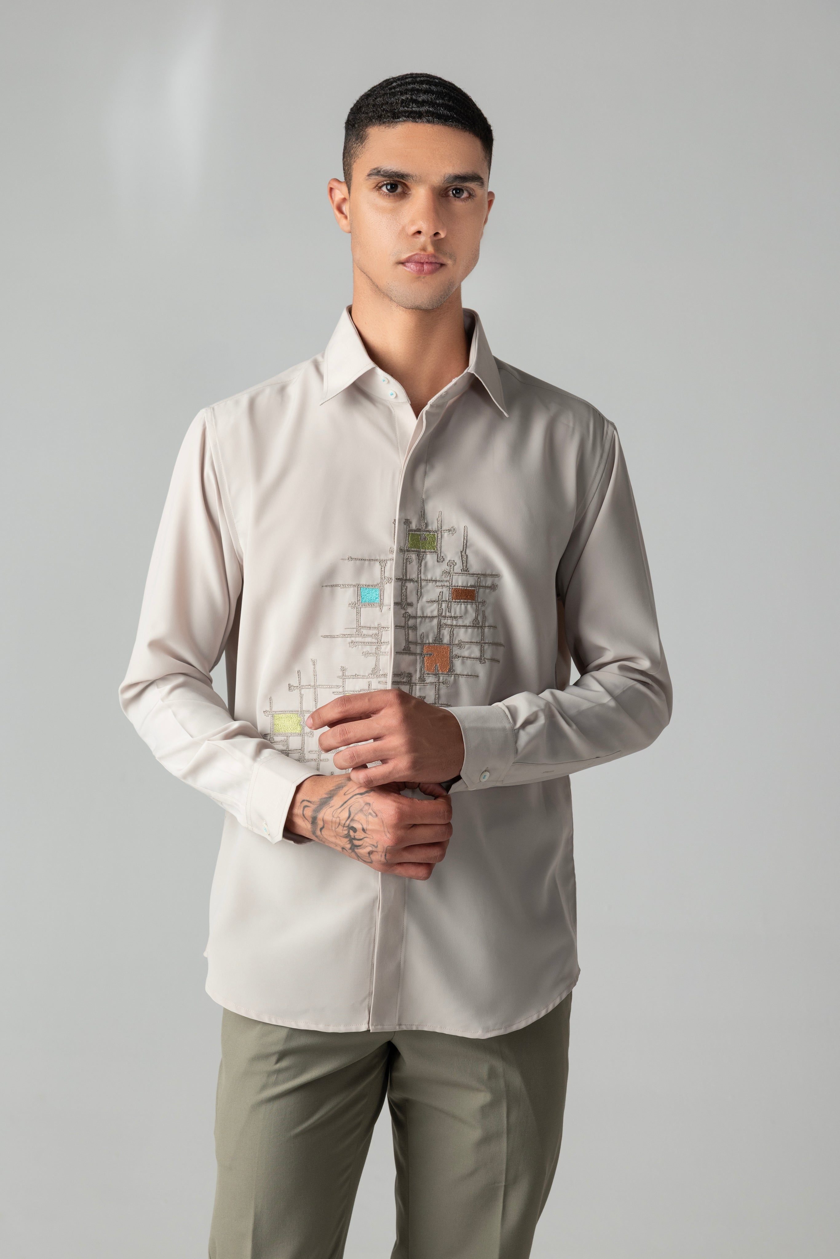 Beige shirt with abstract multi-coloured, geometrical embroidery