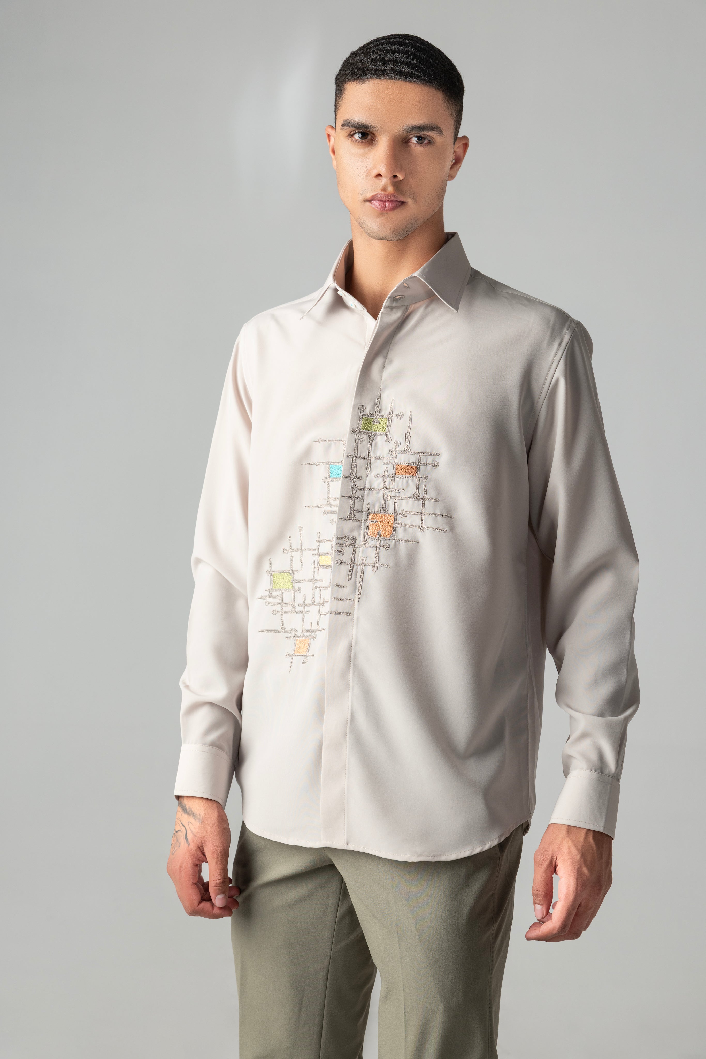 Beige shirt with abstract multi-coloured, geometrical embroidery