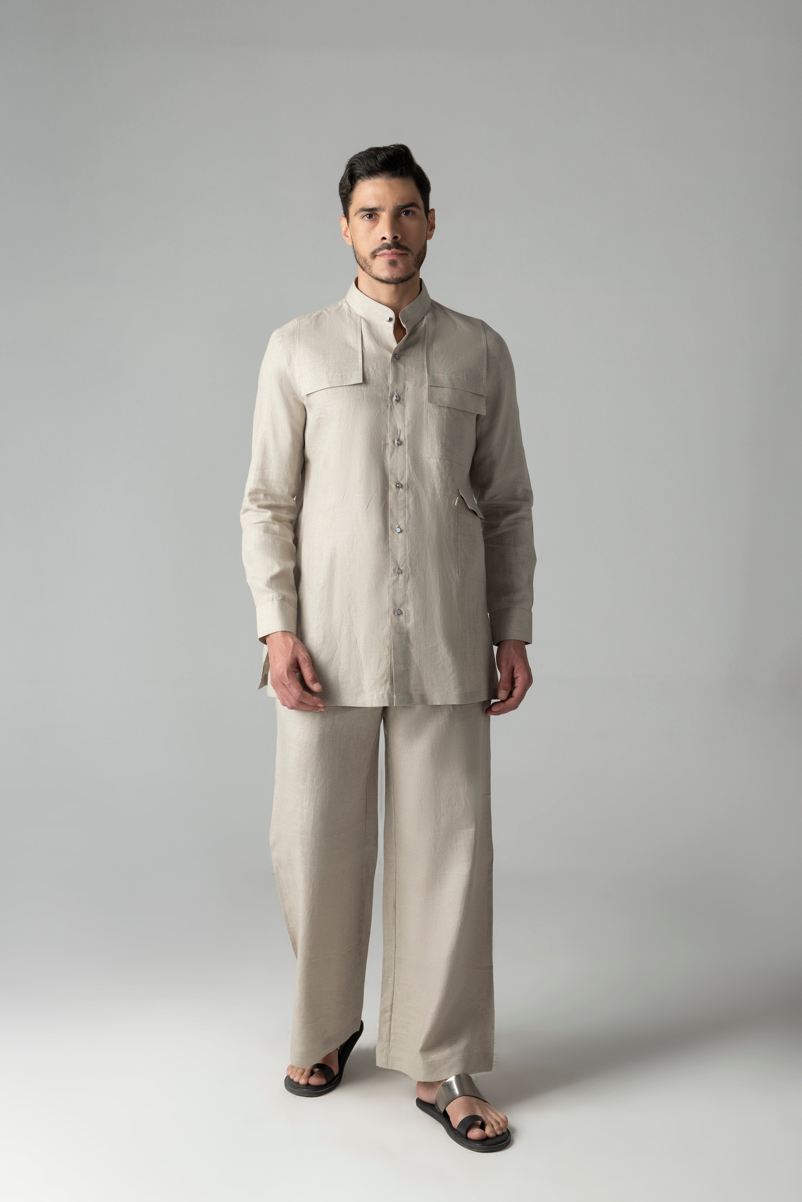 Beige linen short kurta with patch pocket detailing, paired with a matching plazzo