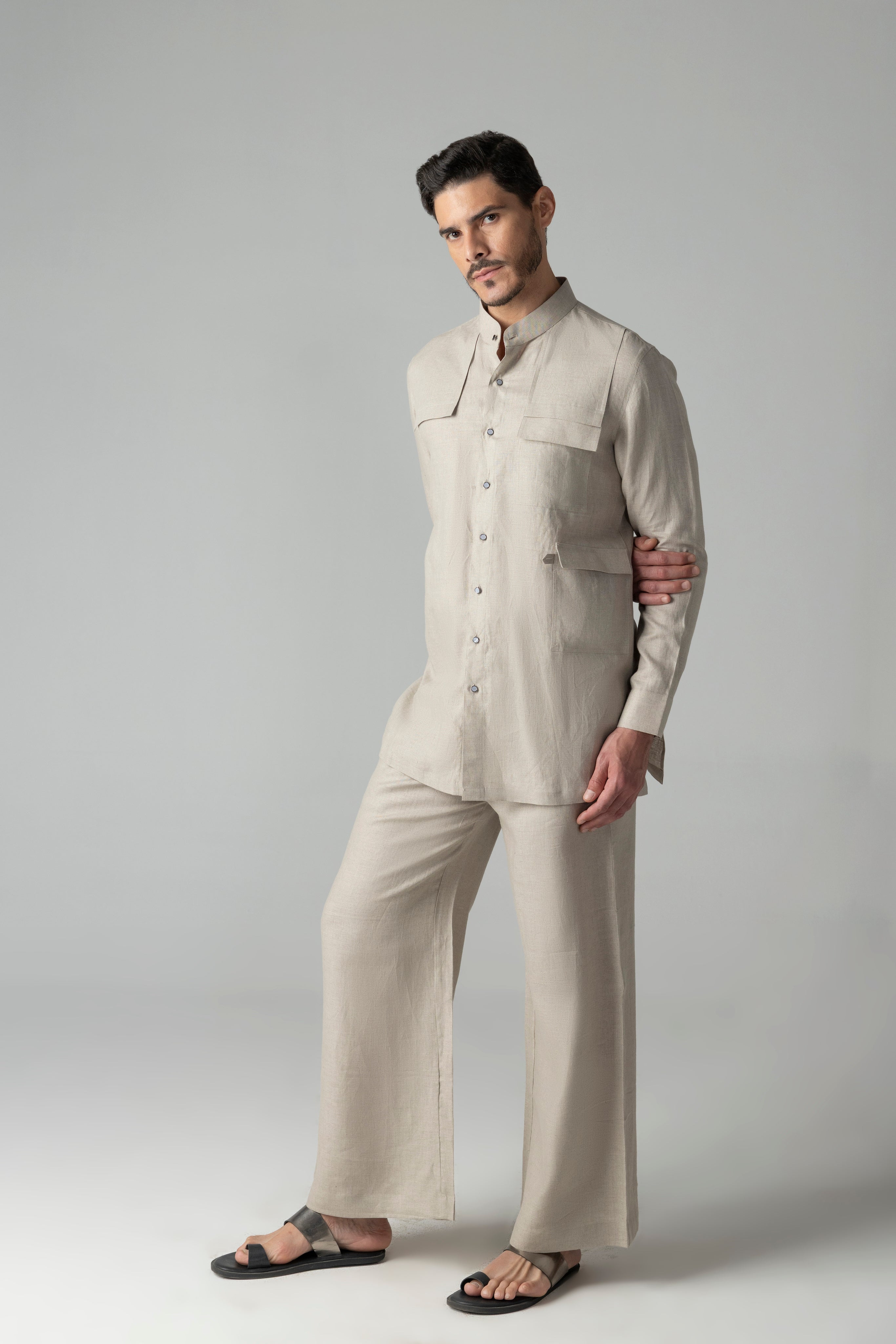 Beige linen short kurta with patch pocket detailing, paired with a matching plazzo