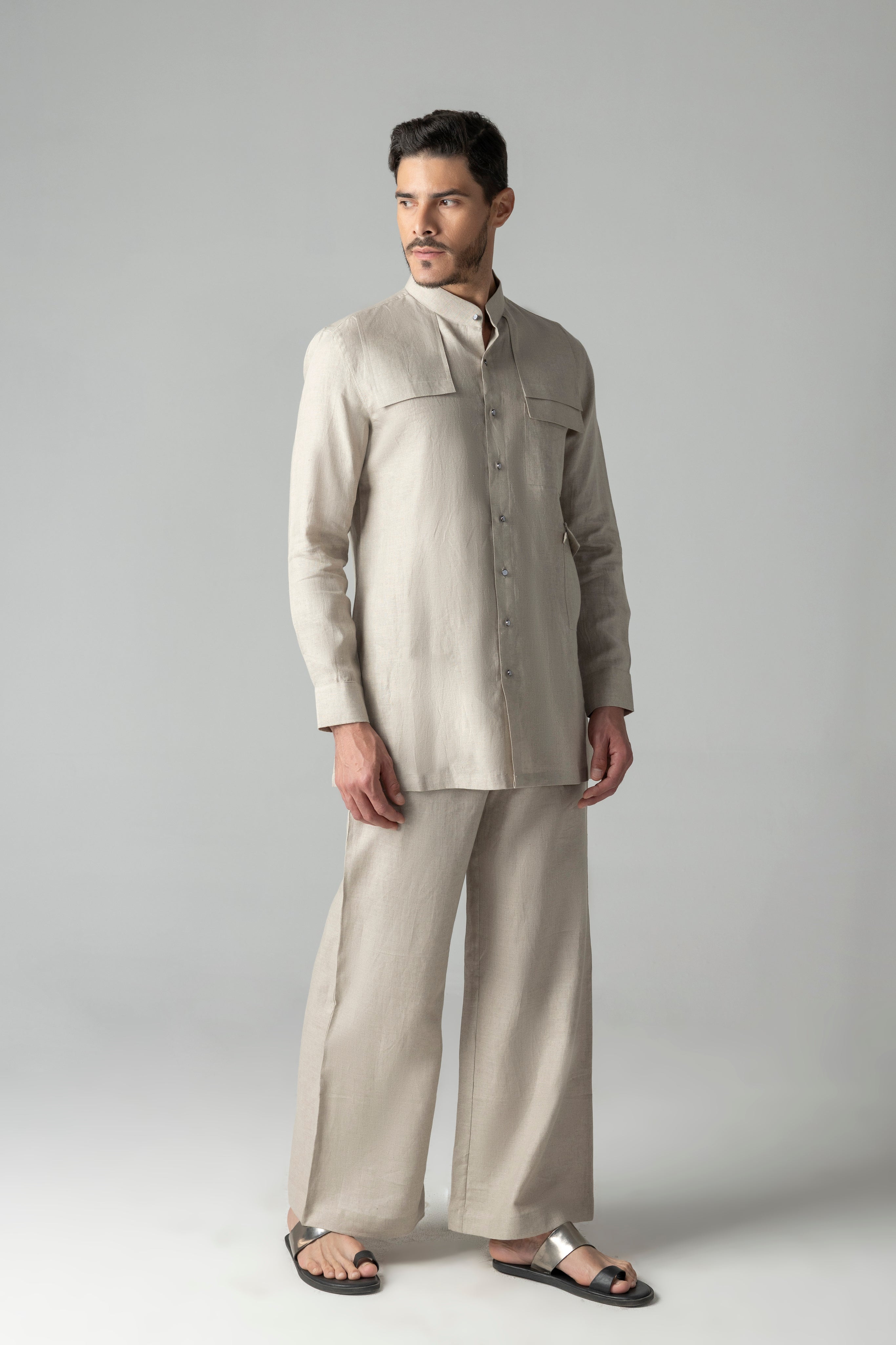 Beige linen short kurta with patch pocket detailing, paired with a matching plazzo