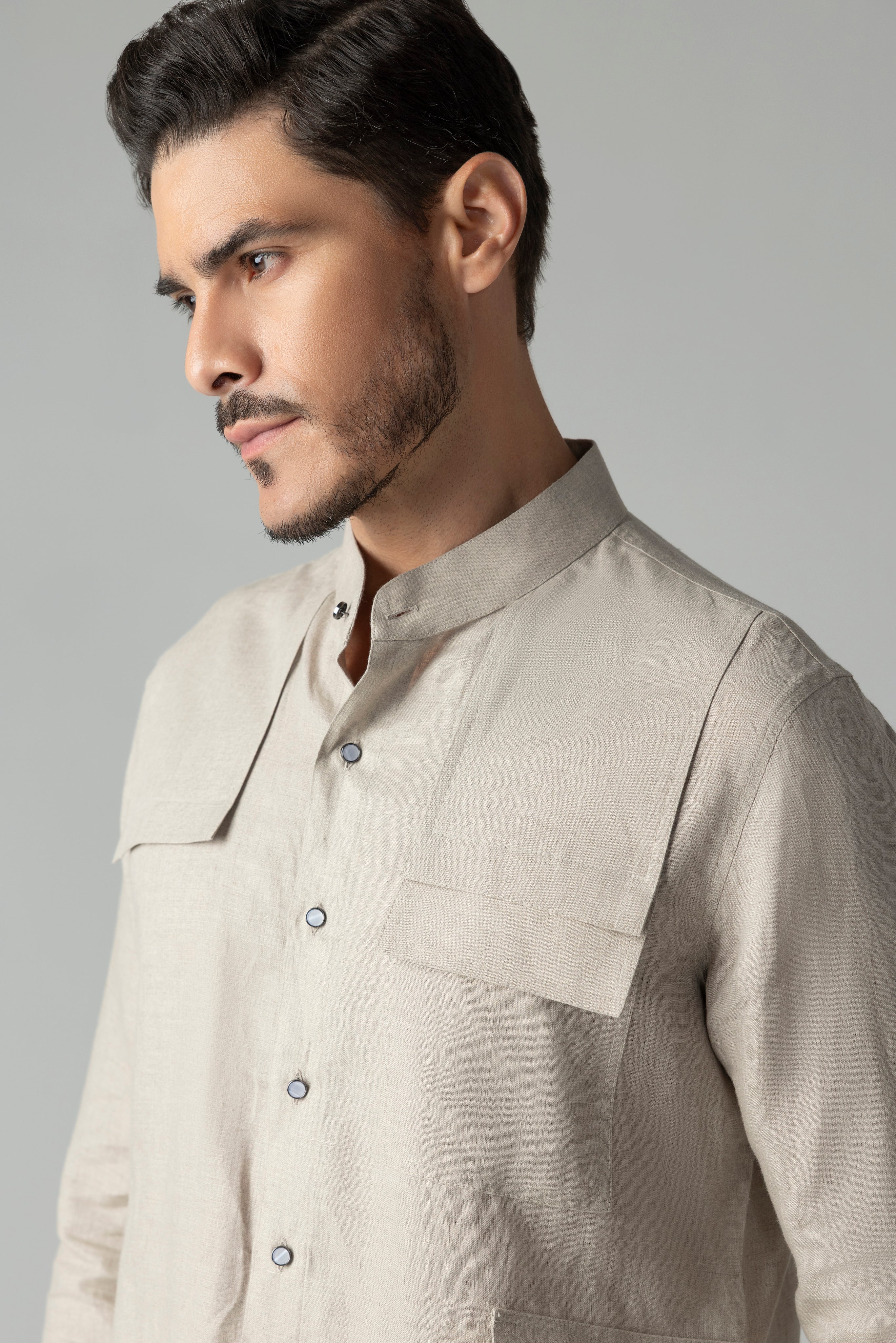Beige linen short kurta with patch pocket detailing, paired with a matching plazzo
