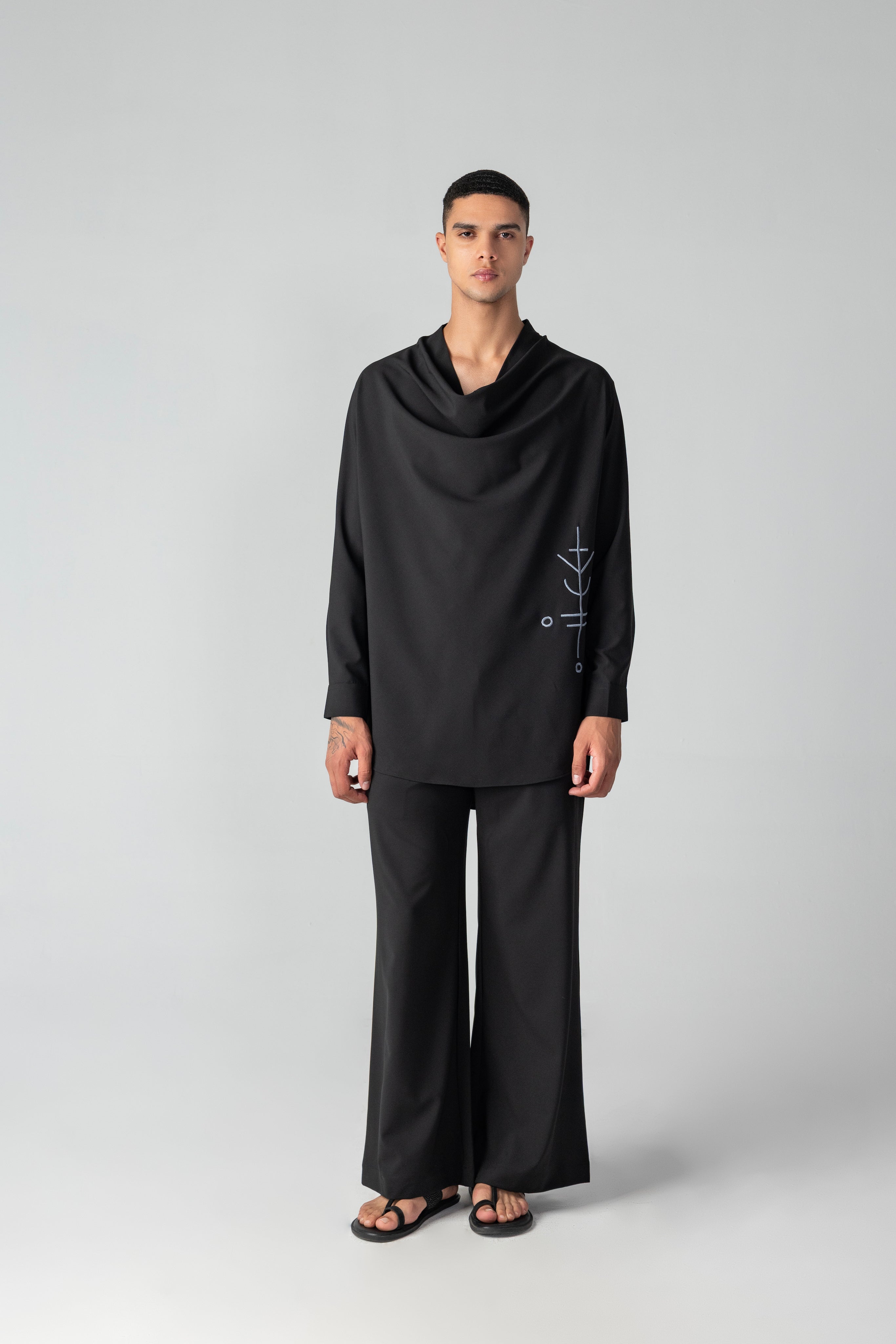 Black short crepe, cowl-neck kurta with thread embroidery detailing, paired with a matching plazzo