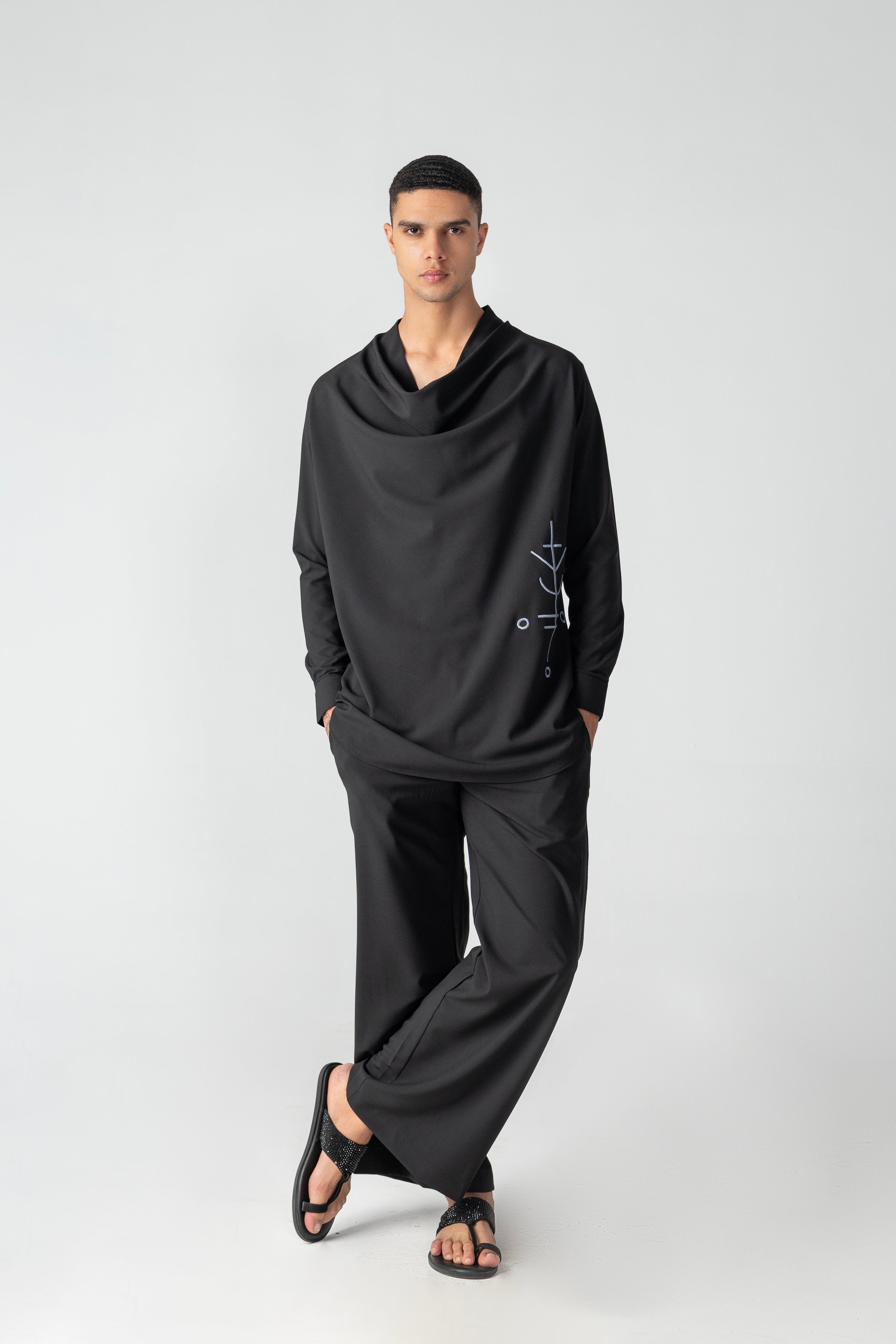 Black short crepe, cowl-neck kurta with thread embroidery detailing, paired with a matching plazzo