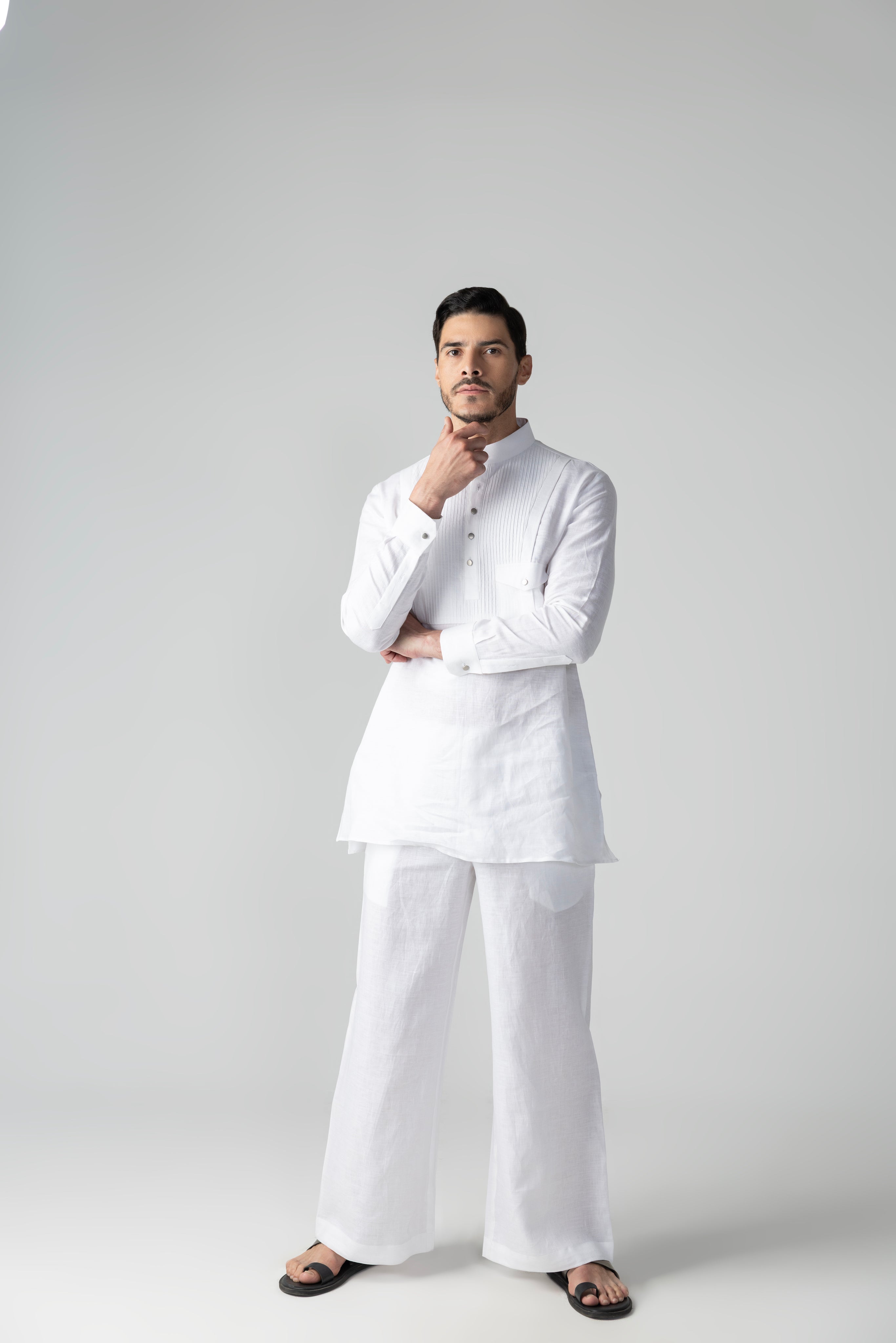 White short linen kurta with patch pocket & pintucks detailing, paired with a matching plazzo