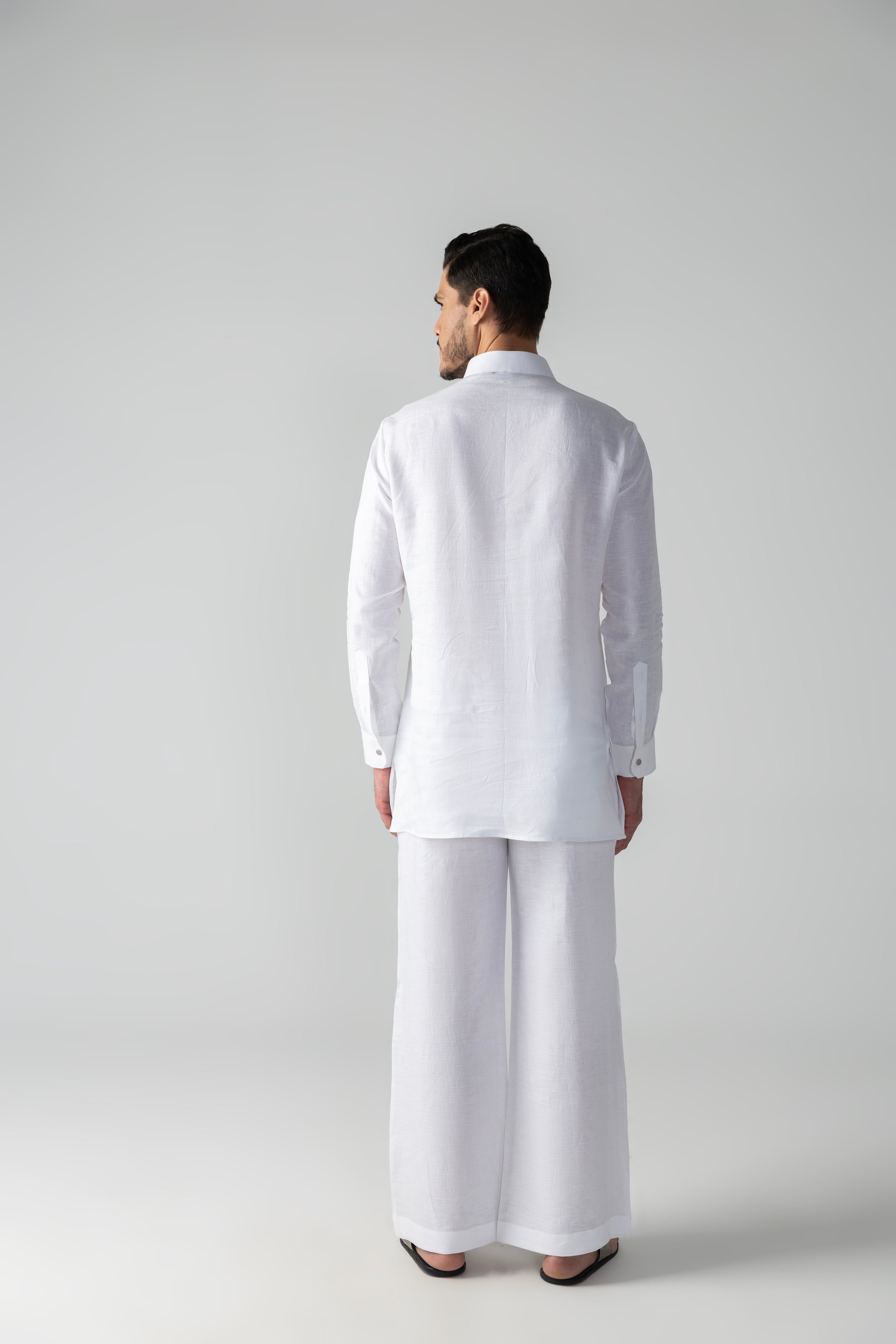 White short linen kurta with patch pocket & pintucks detailing, paired with a matching plazzo