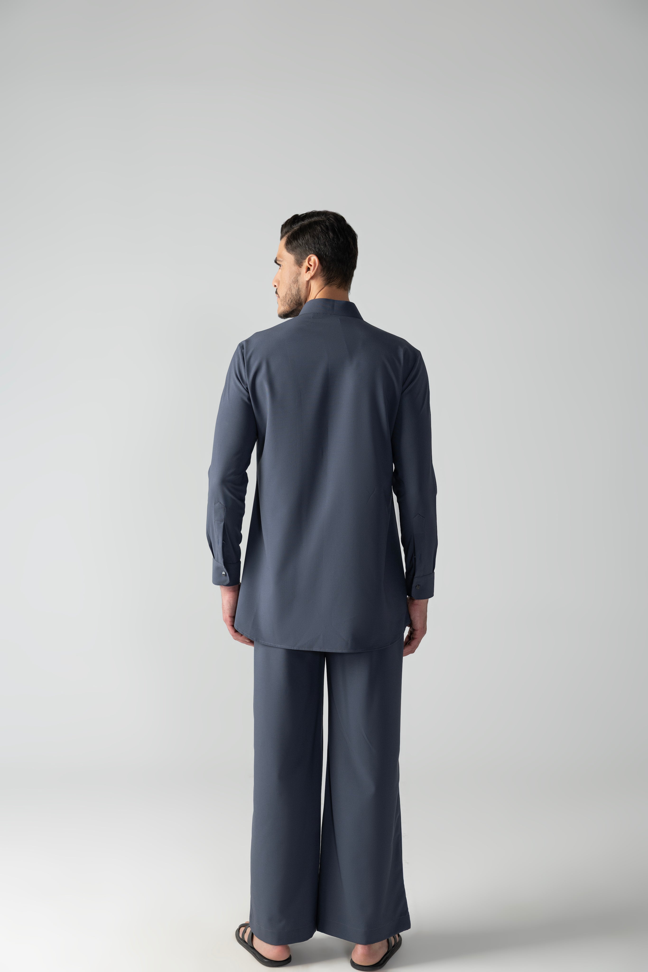 Dark grey short crepe kurta with embroidered patch pocket & zipper detailing, paired with a matching plazzo
